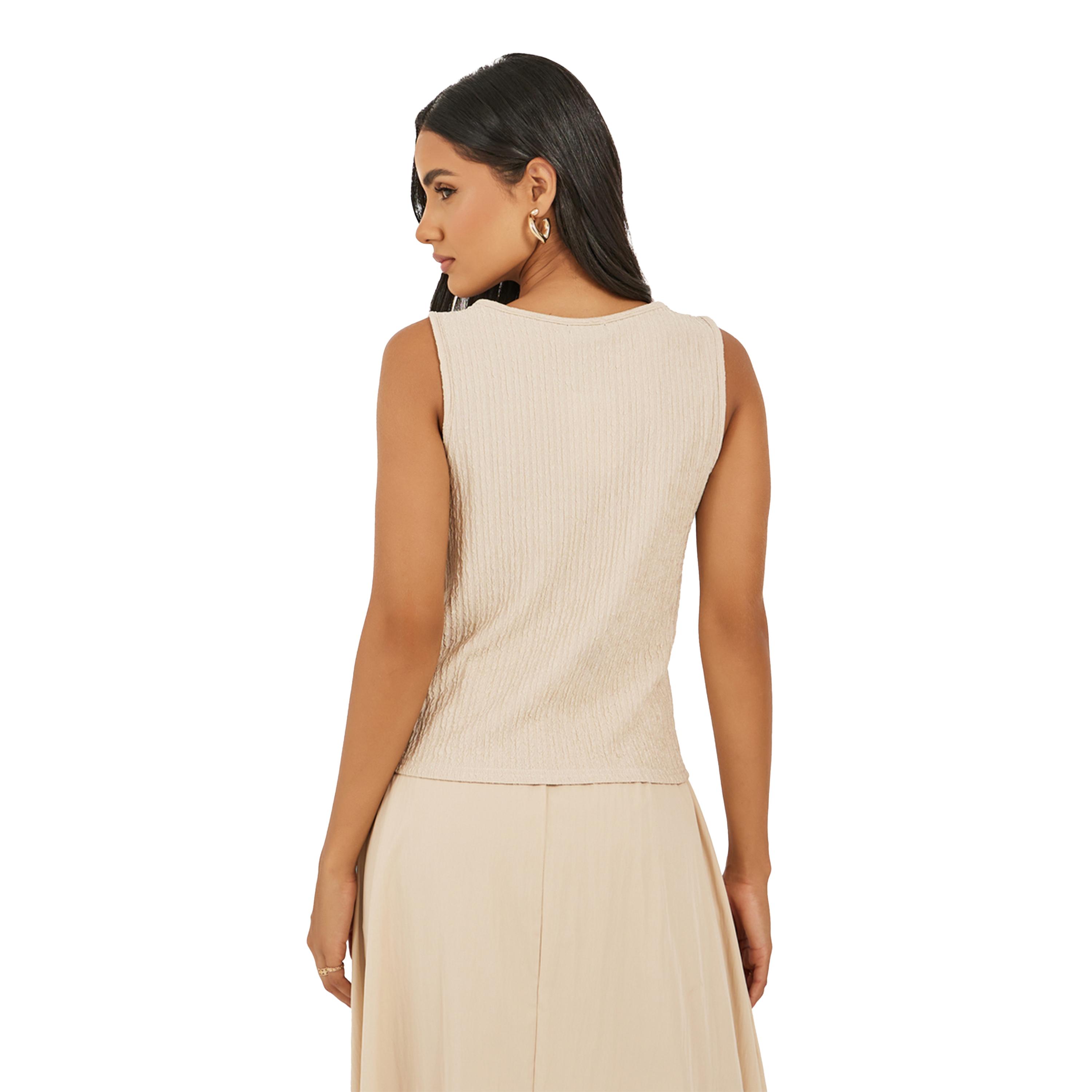ستايلي -  بلوزة نسائية محبوكة بدون أكمام برباط أمامي مضلع باللون البيج-women-clothing-tshirts-image-4