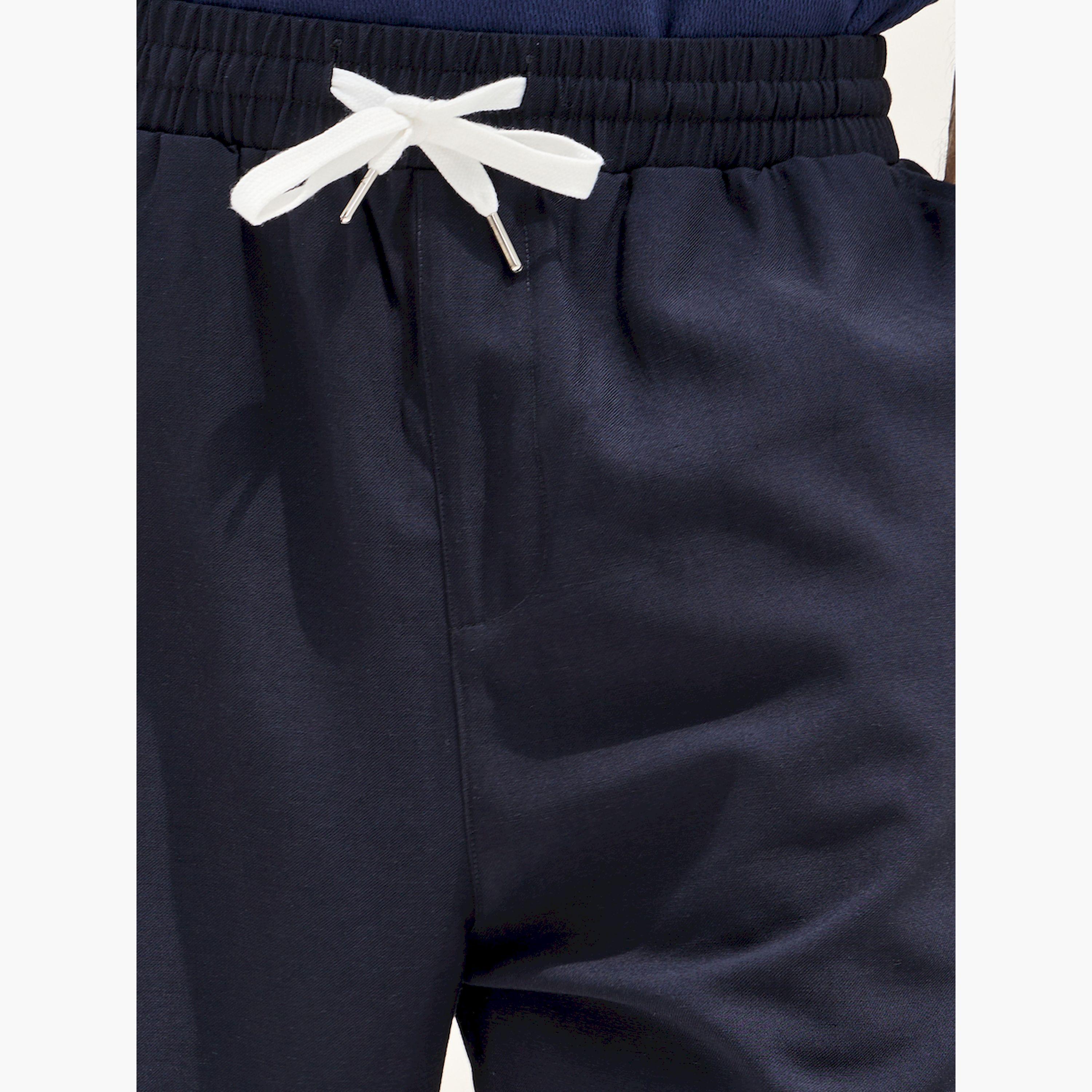 ستايلي -  بنطال من مزيج الكتان الموحد بقصّة البالون مع تفاصيل مطوية-men-clothing-bottoms-joggers-image-3