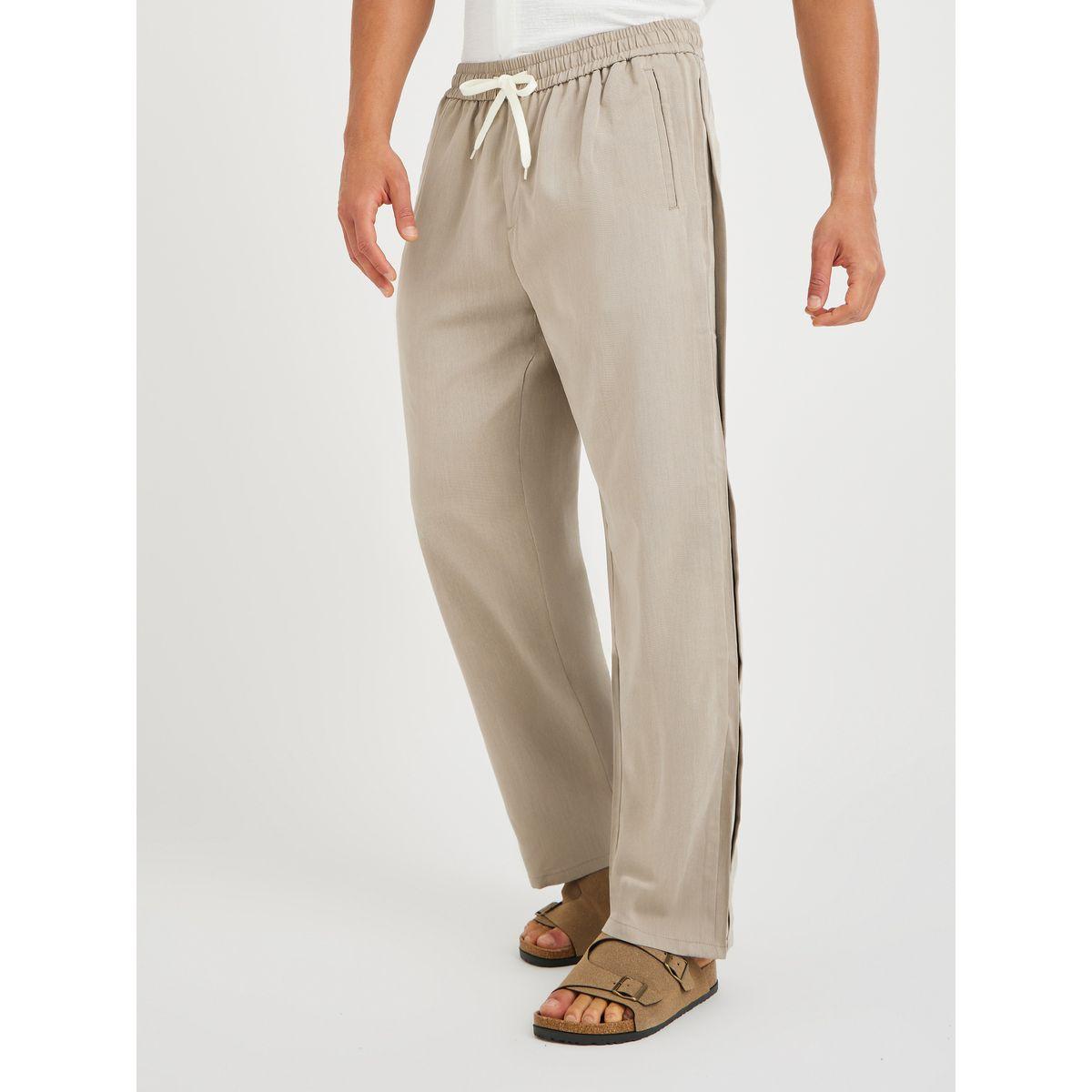 بنطال رياضي سادة بقصة مريحة وجيب مائل-men-clothing-bottoms-joggers-image-4