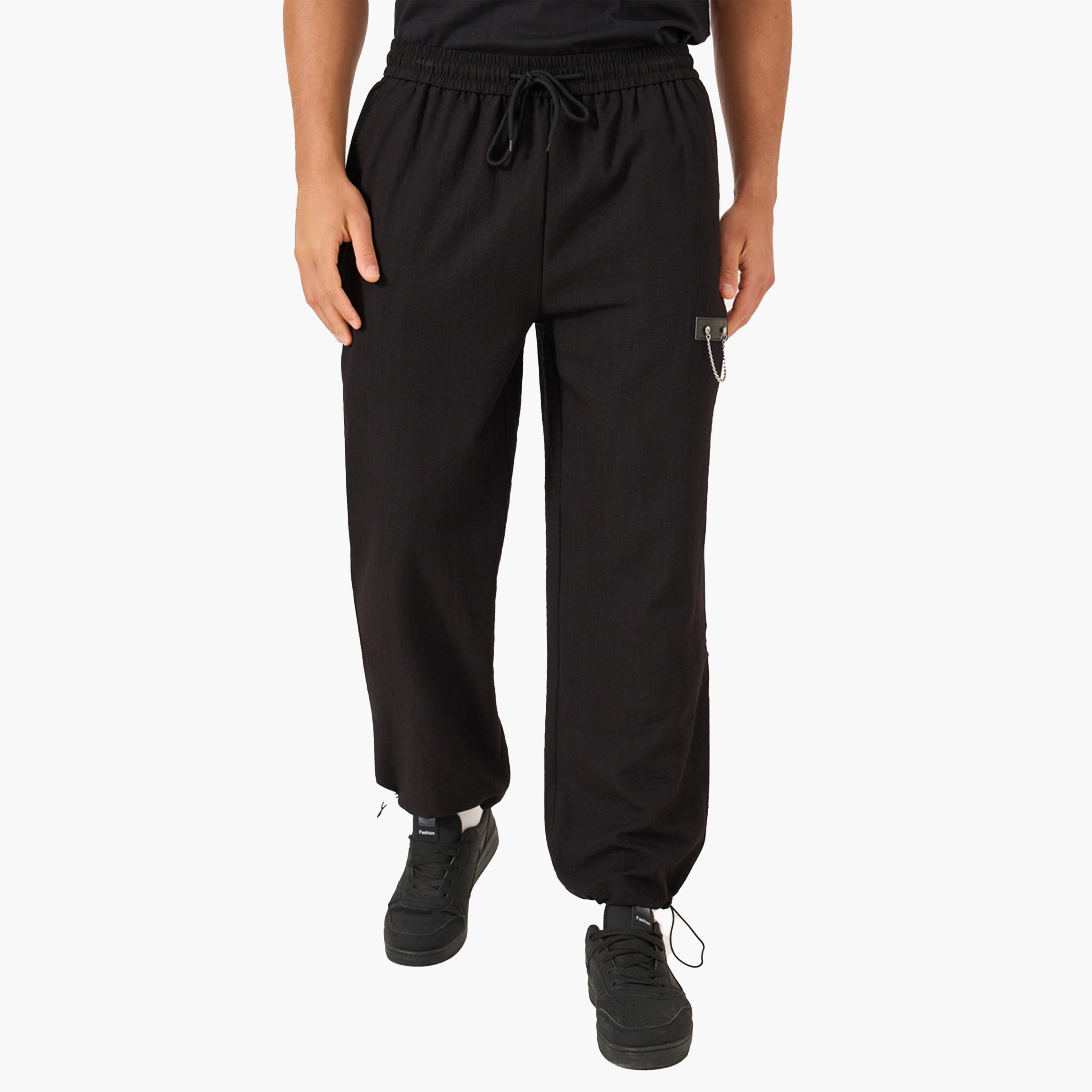 بنطال سادة بقصة مريحة ورباط خصر-men-clothing-bottoms-joggers-image-1