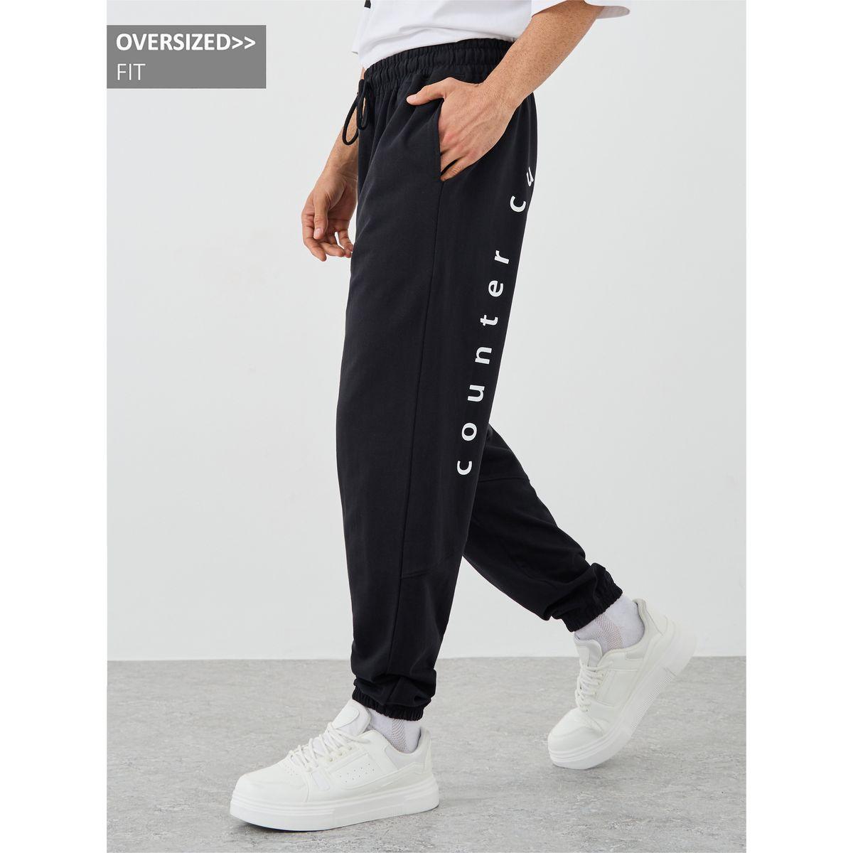 جوغر فضفاض بطبعة كتابة وأربطة-men-clothing-bottoms-joggers-image-1