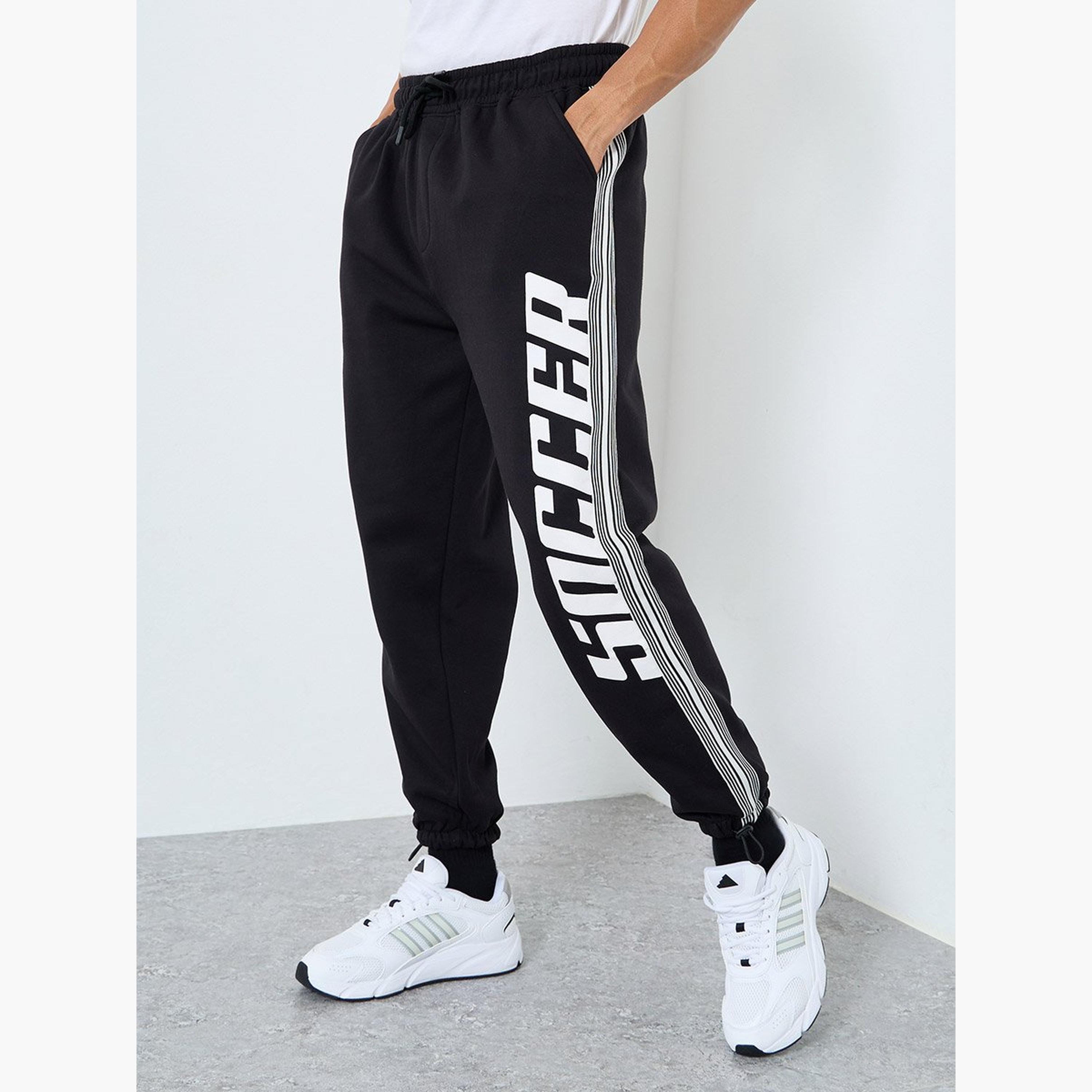 Styli Men Black Graphic Oversized Joggers with Tape Detail-men-clothing-sportswearandactivewear-bottoms-joggers-image-1