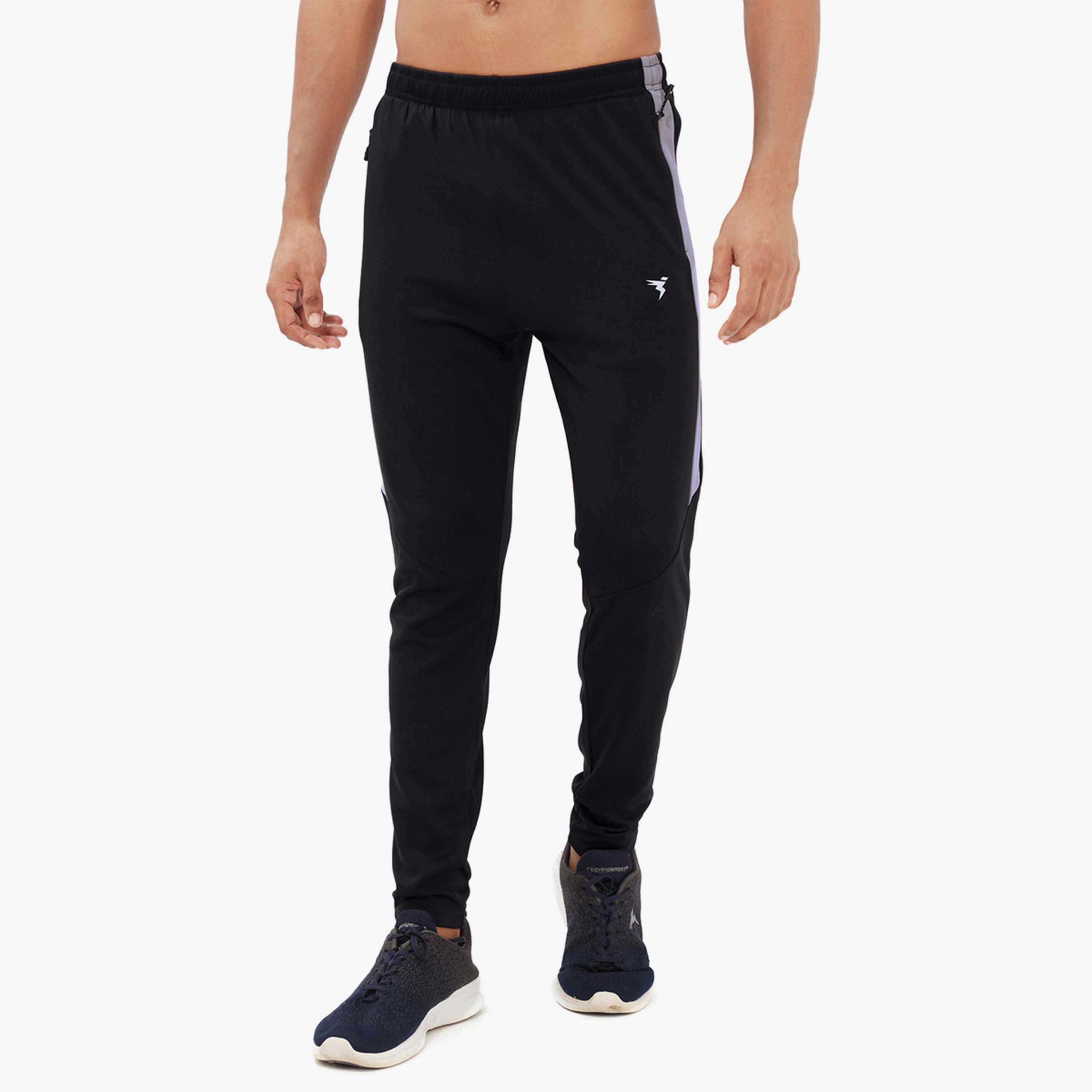 تكنوسبورت × ستايلي - بنطال رياضي رجالي ضيق سادة بقماش تكنو دراي-men-clothing-sportswearandactivewear-bottoms-joggers-image-1