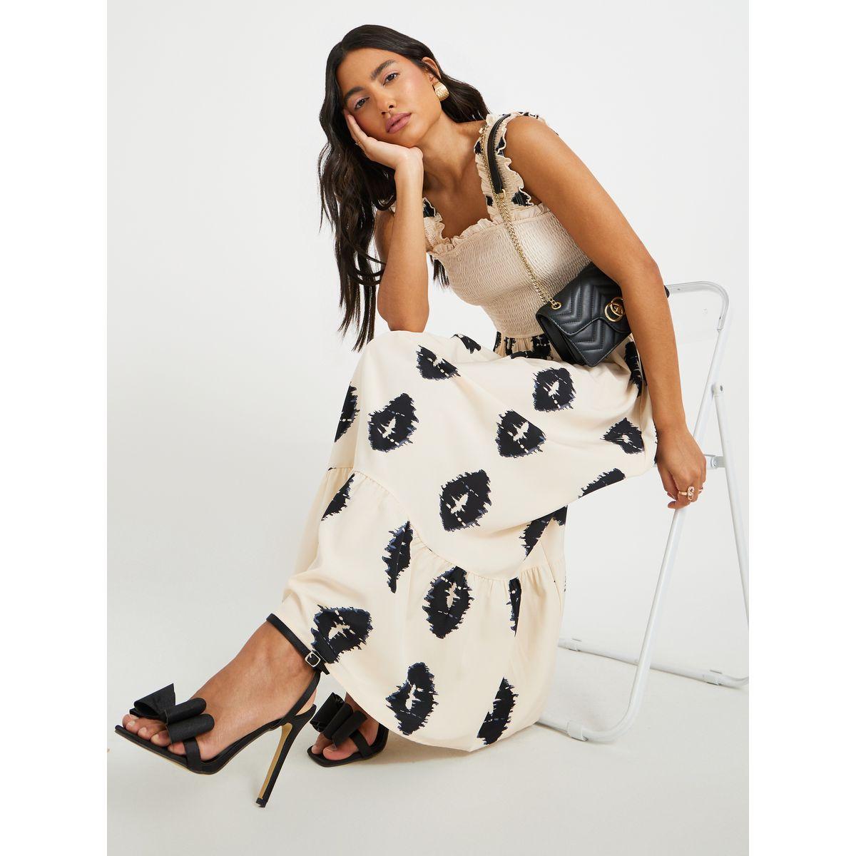 فستان طويل مطبع بلا أكمام مع حافة واسعة-women-clothing-dresses-image-1