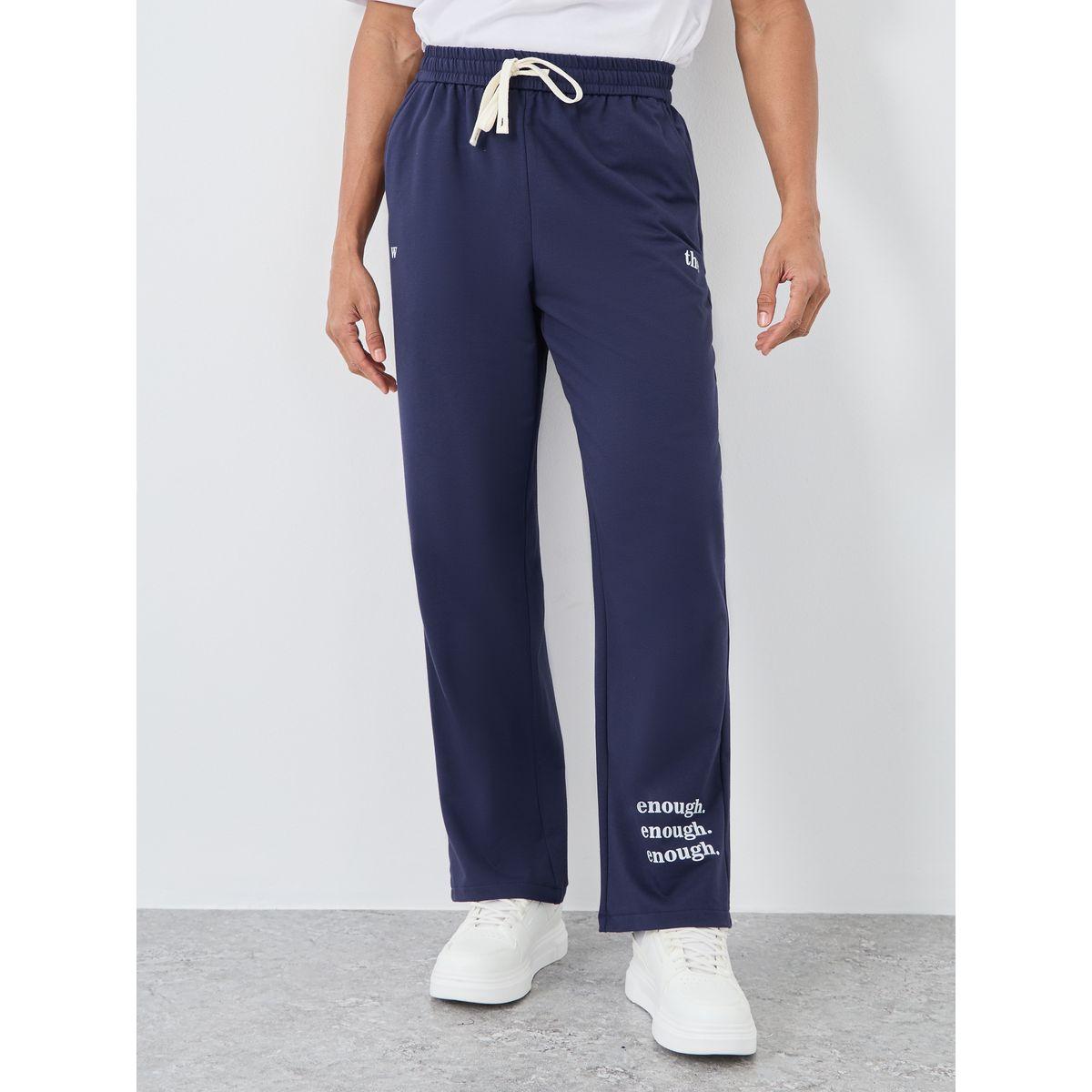 جوغر مُطبع بقصة مريحة مع تفاصيل أربطة-men-clothing-bottoms-joggers-image-1