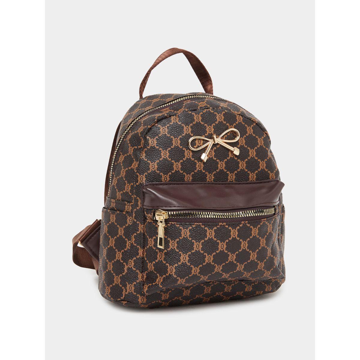 شنطة ظهر مُطبعة بتفاصيل فيونكة-women-bagsandwallets-backpacks-image-1