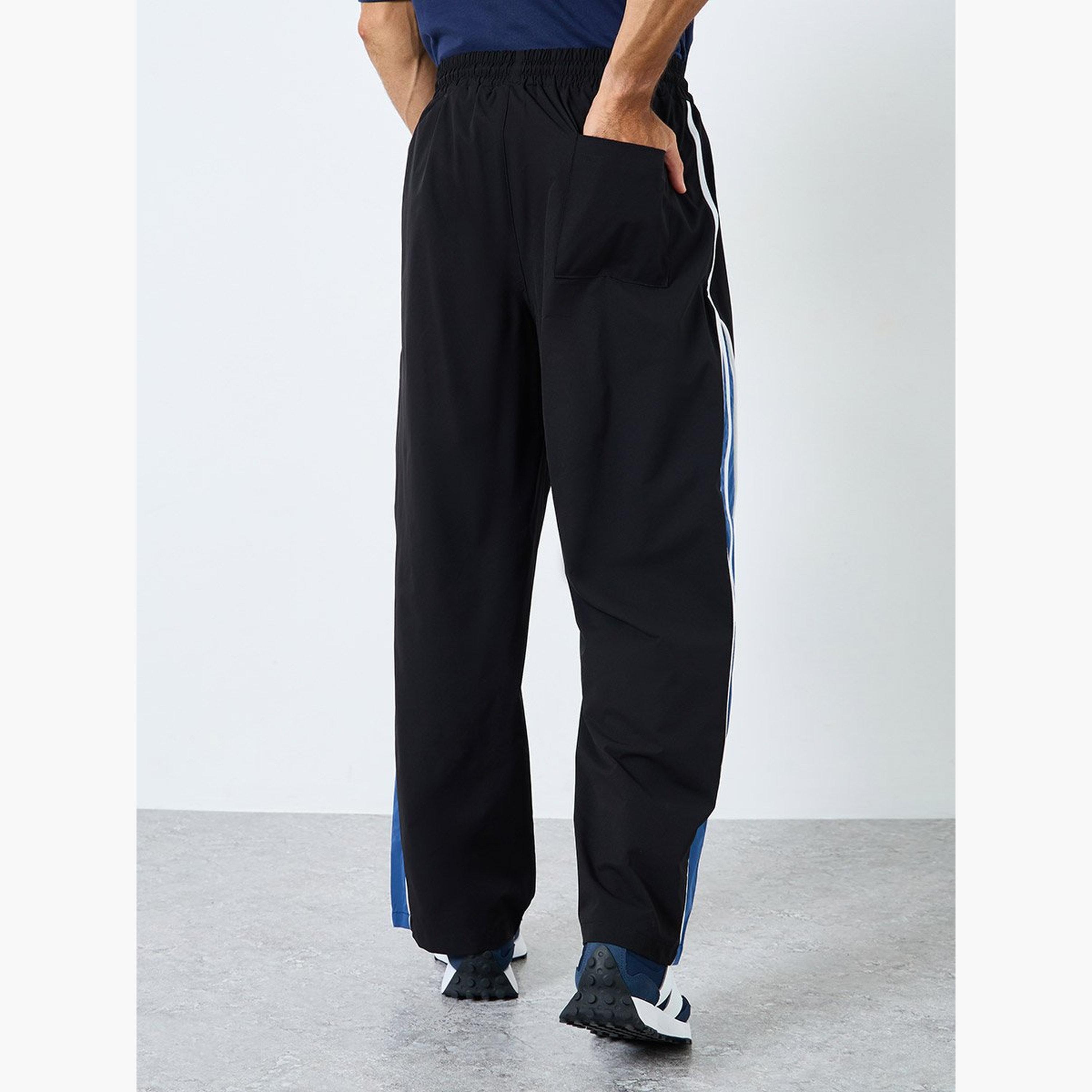 ستايلي - بنطال باراشوت بقصّة وحياكة واسعة-men-clothing-sportswearandactivewear-bottoms-image-4