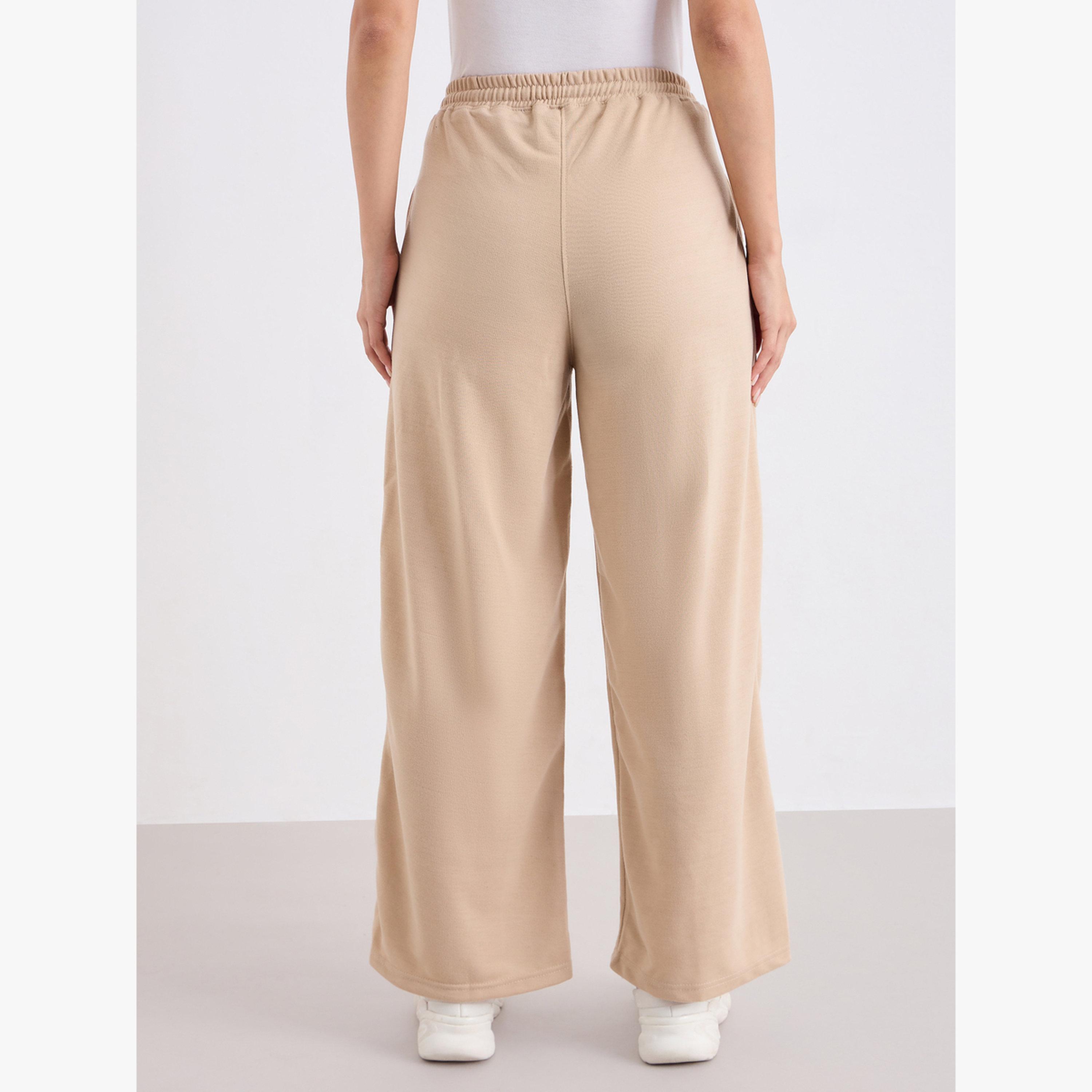 جوغر بأرجل واسعة وتفاصيل محزوزة-women-clothing-bottoms-joggers-image-3