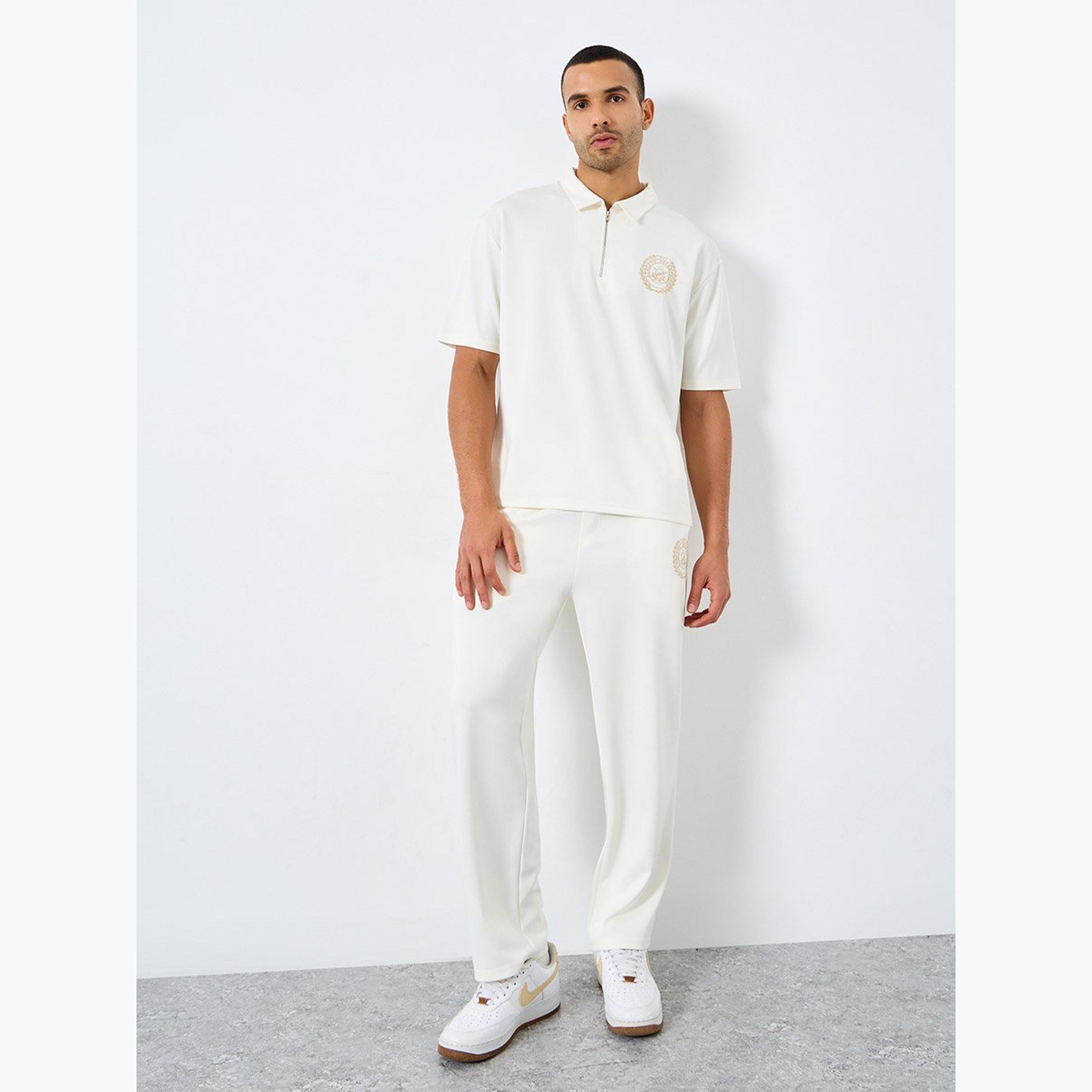 ستايلي - قميص بولو مطرز مقاس كبير وبنطال رياضي قصّة مريحة-men-clothing-coordsets-image-1