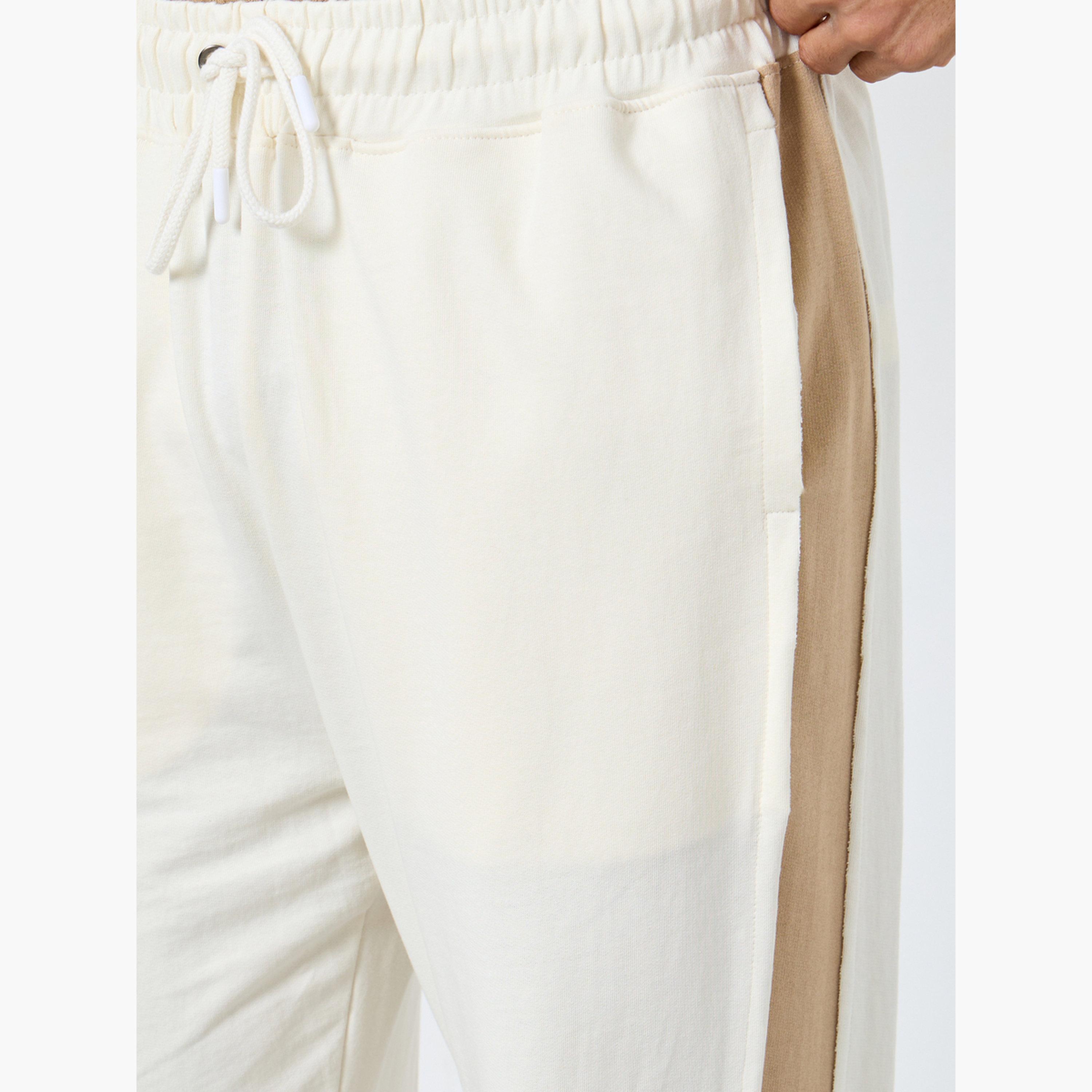 ستايلي - بنطال رياضي حجم كبير ذو لوحة جانبية لون كريمي-men-clothing-bottoms-joggers-image-3
