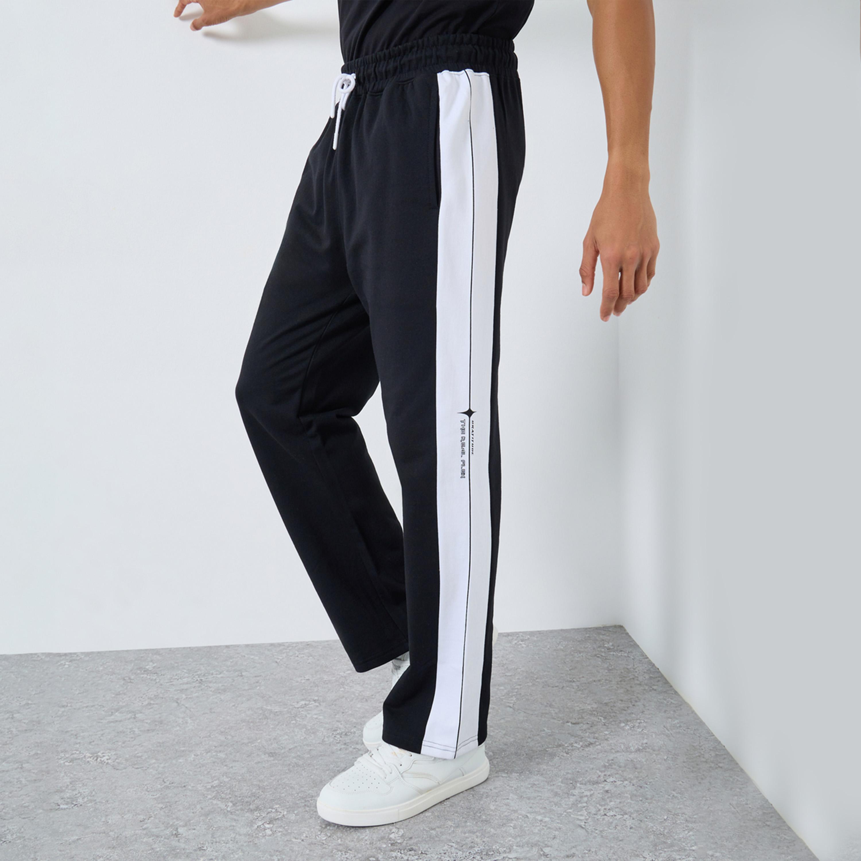 ستايلي - بنطال رياضي رجالي أسود حجم كبير طبعة شعار-men-clothing-bottoms-joggers-image-1