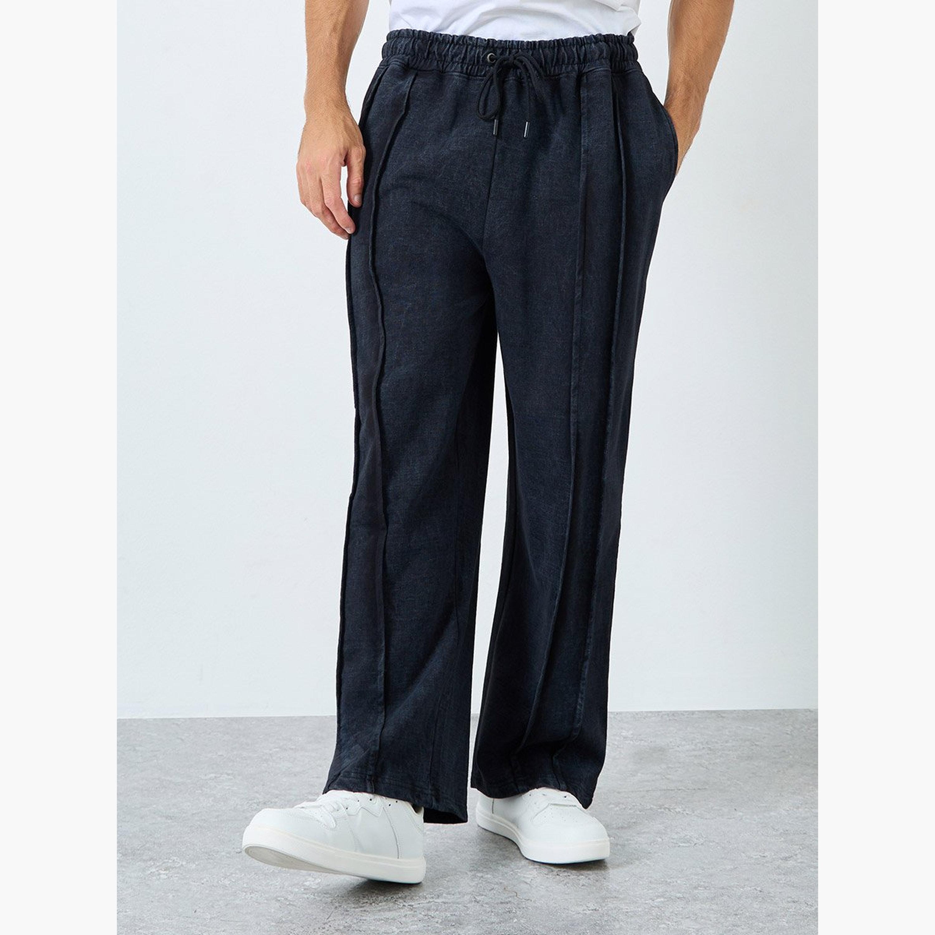 ستايلي - بنطال رياضي تيري واسع الساق مع تفاصيل مطوية-men-clothing-sportswearandactivewear-bottoms-joggers-image-1