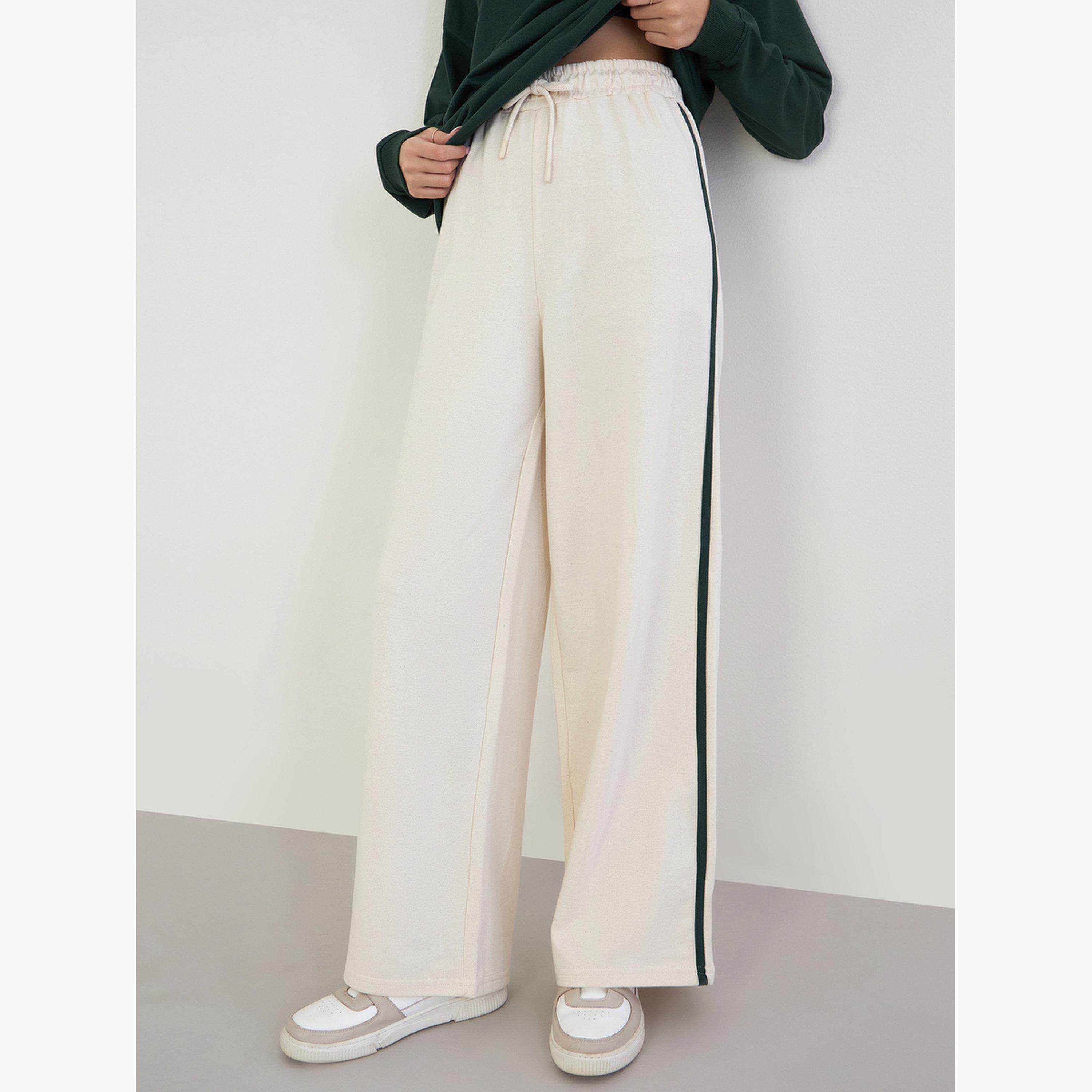 ستايلي - قميص رياضي طويل واسع الحجم مع بنطال رياضي واسع الساق-women-clothing-coordsets-image-4