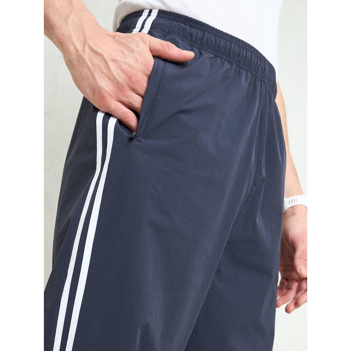 بنطال باراشوت باجي بتفاصيل أنبوبية-men-clothing-bottoms-trousersandchinos-trousers-image-4