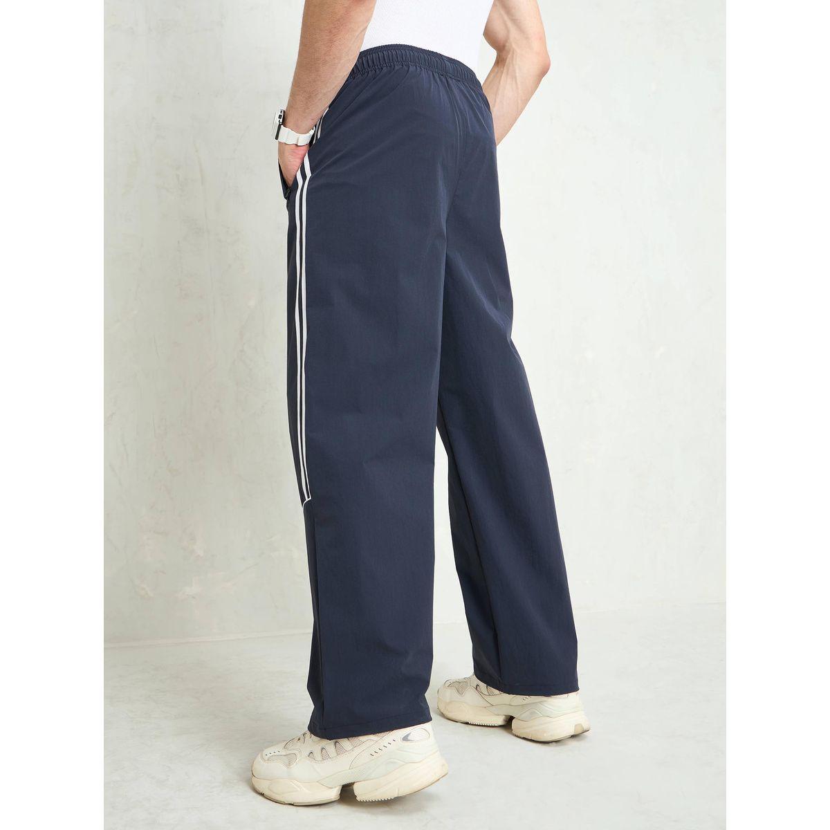 بنطال باراشوت باجي بتفاصيل أنبوبية-men-clothing-bottoms-trousersandchinos-trousers-image-5