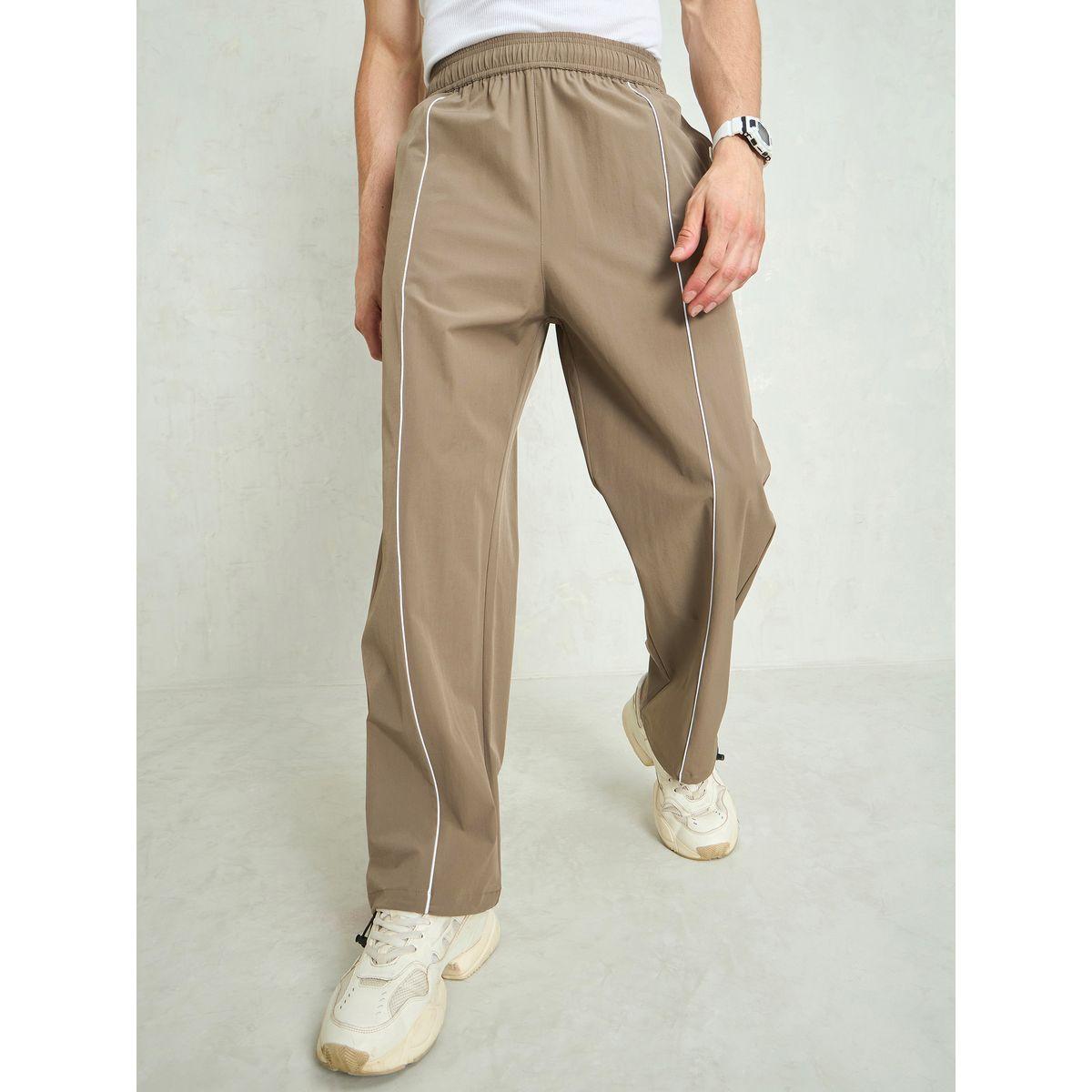 بنطال باراشوت باجي بتفاصيل أنبوبية-men-clothing-bottoms-trousersandchinos-trousers-image-1