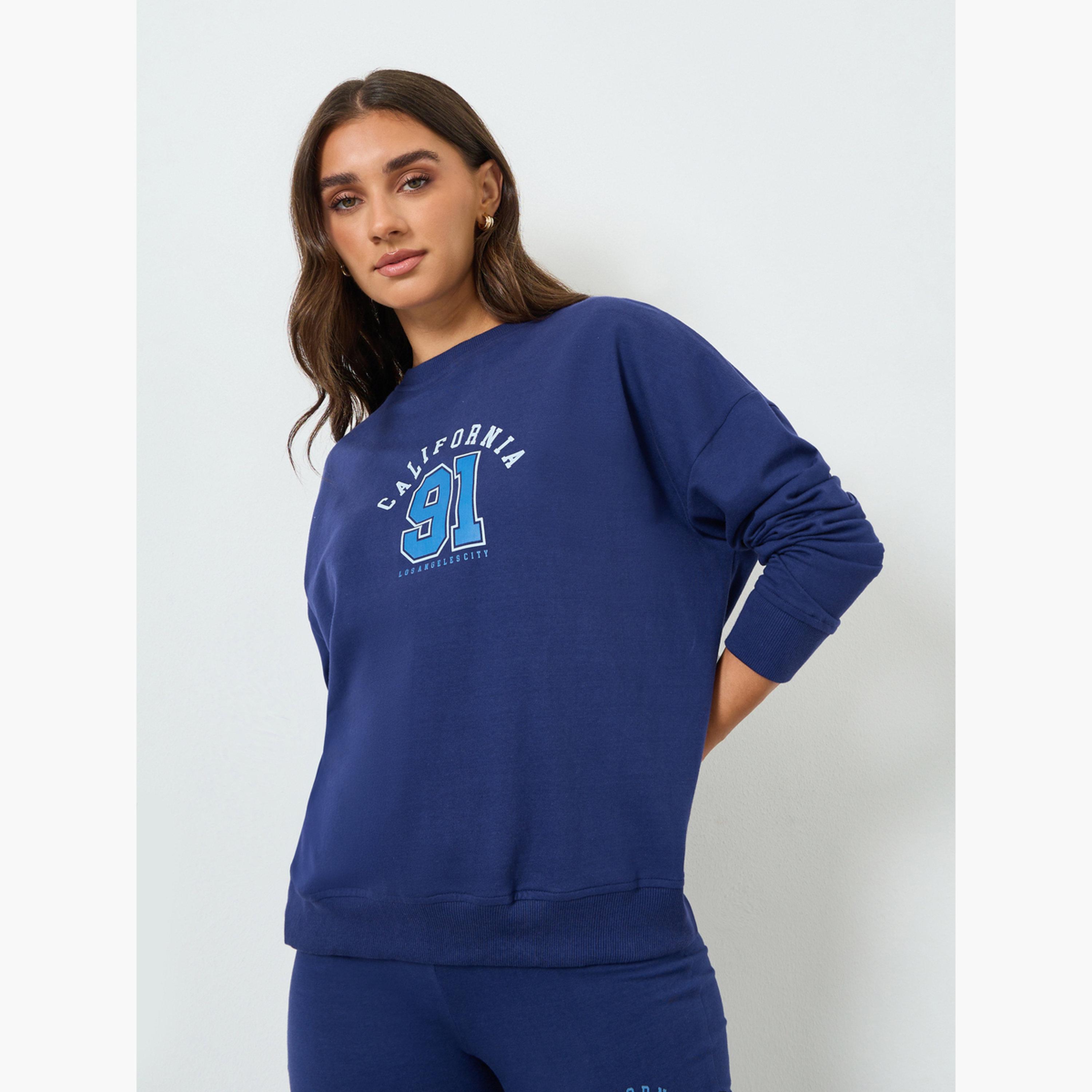 طقم منسق من بنطال بأرجل واسعة وسويت شيرت بطبعة جرافيك-women-clothing-coordsets-image-2