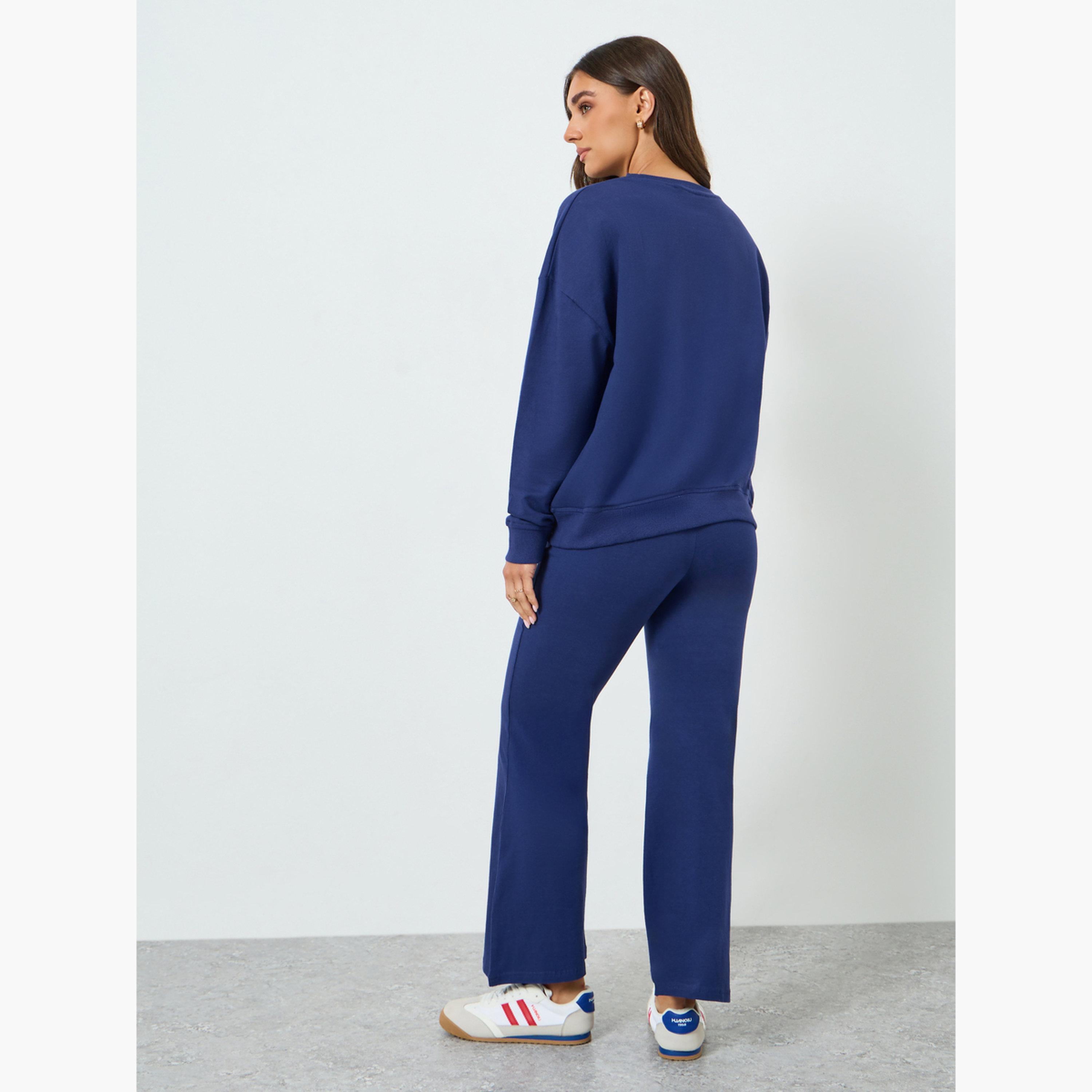 طقم منسق من بنطال بأرجل واسعة وسويت شيرت بطبعة جرافيك-women-clothing-coordsets-image-4