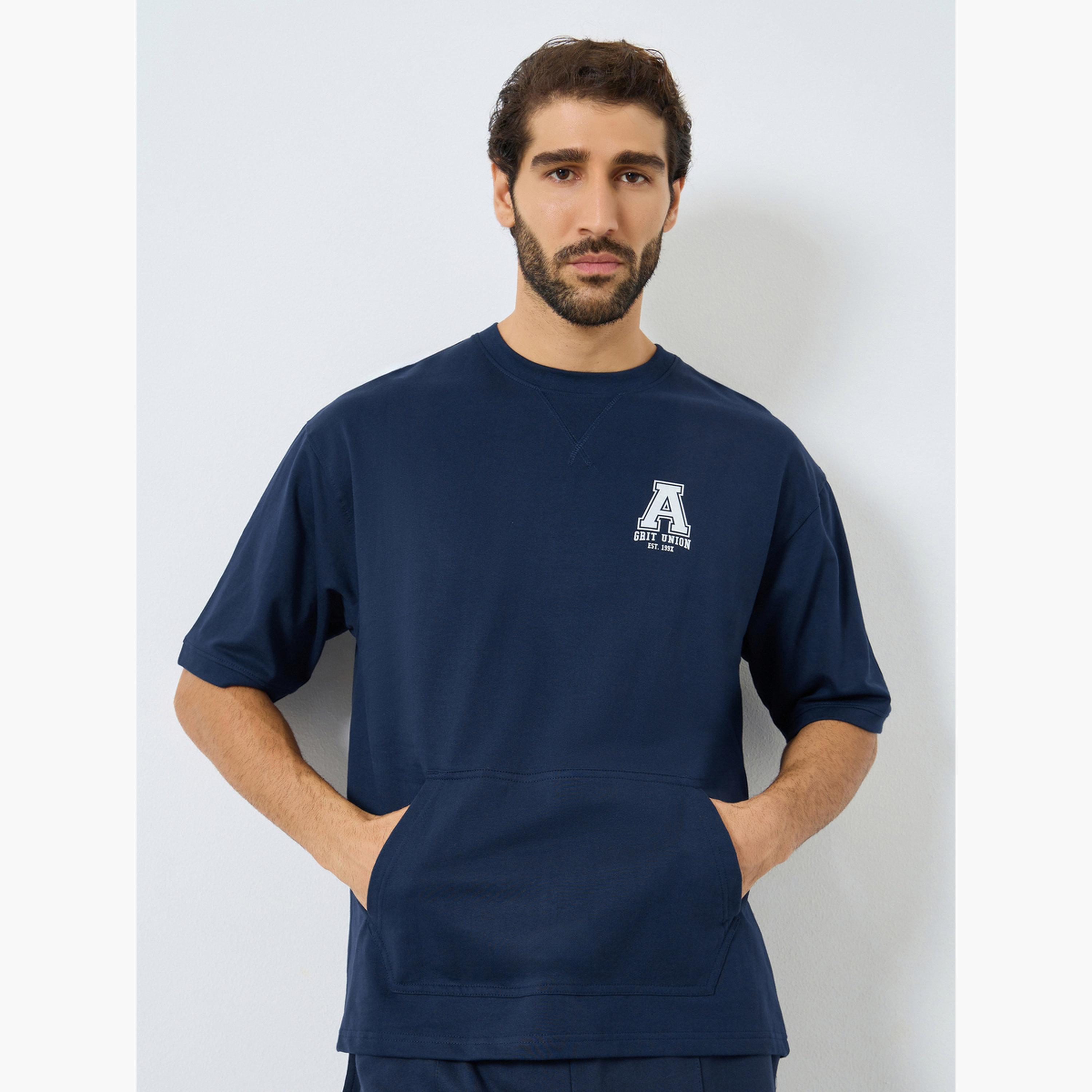 ستايلي - تي شيرت تيري للتدريب تصميم واسع للرجال-men-clothing-sportswearandactivewear-tshirtsandpolos-image-1