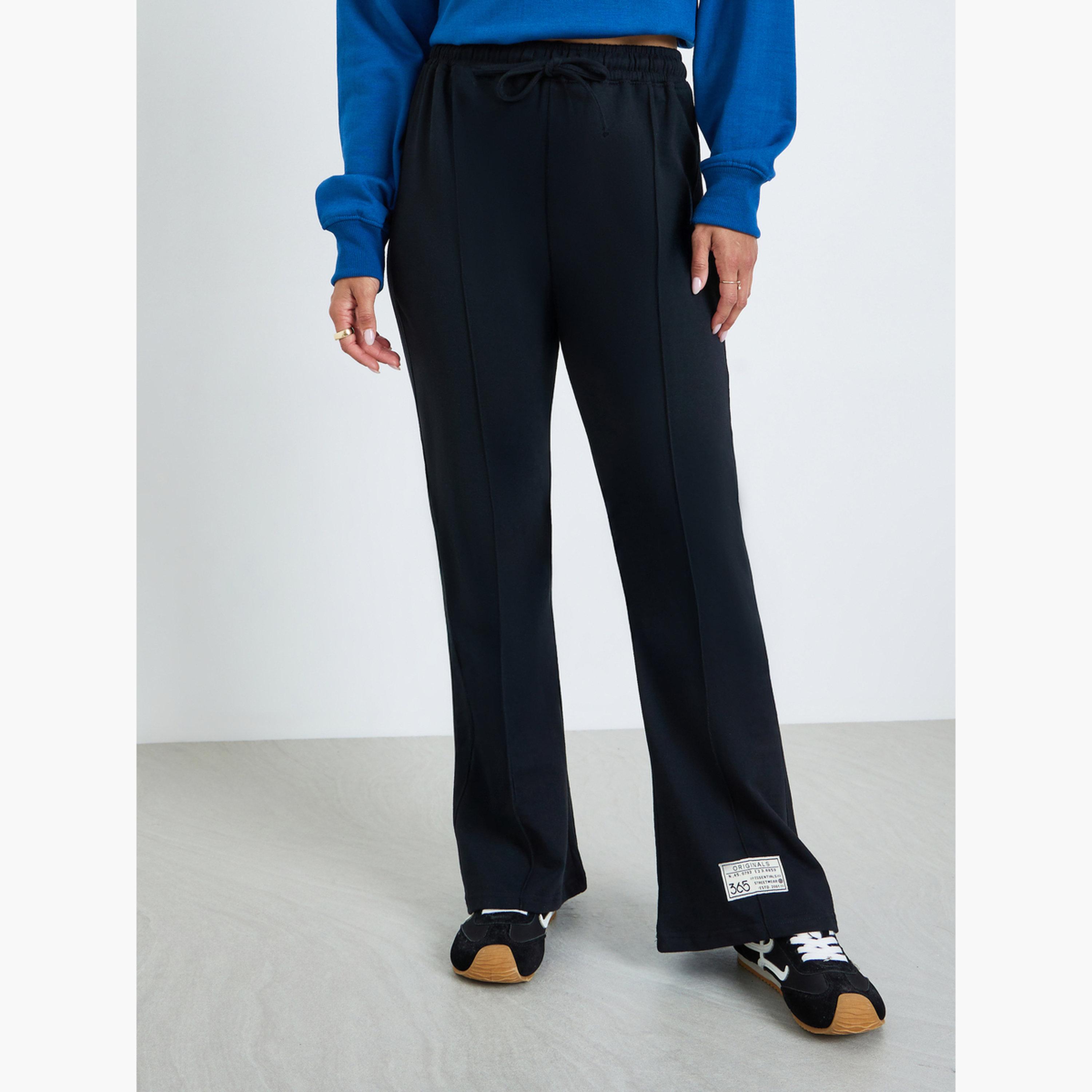 جوغر بأرجل واسعة وتفاصيل شارة-women-clothing-bottoms-joggers-image-1