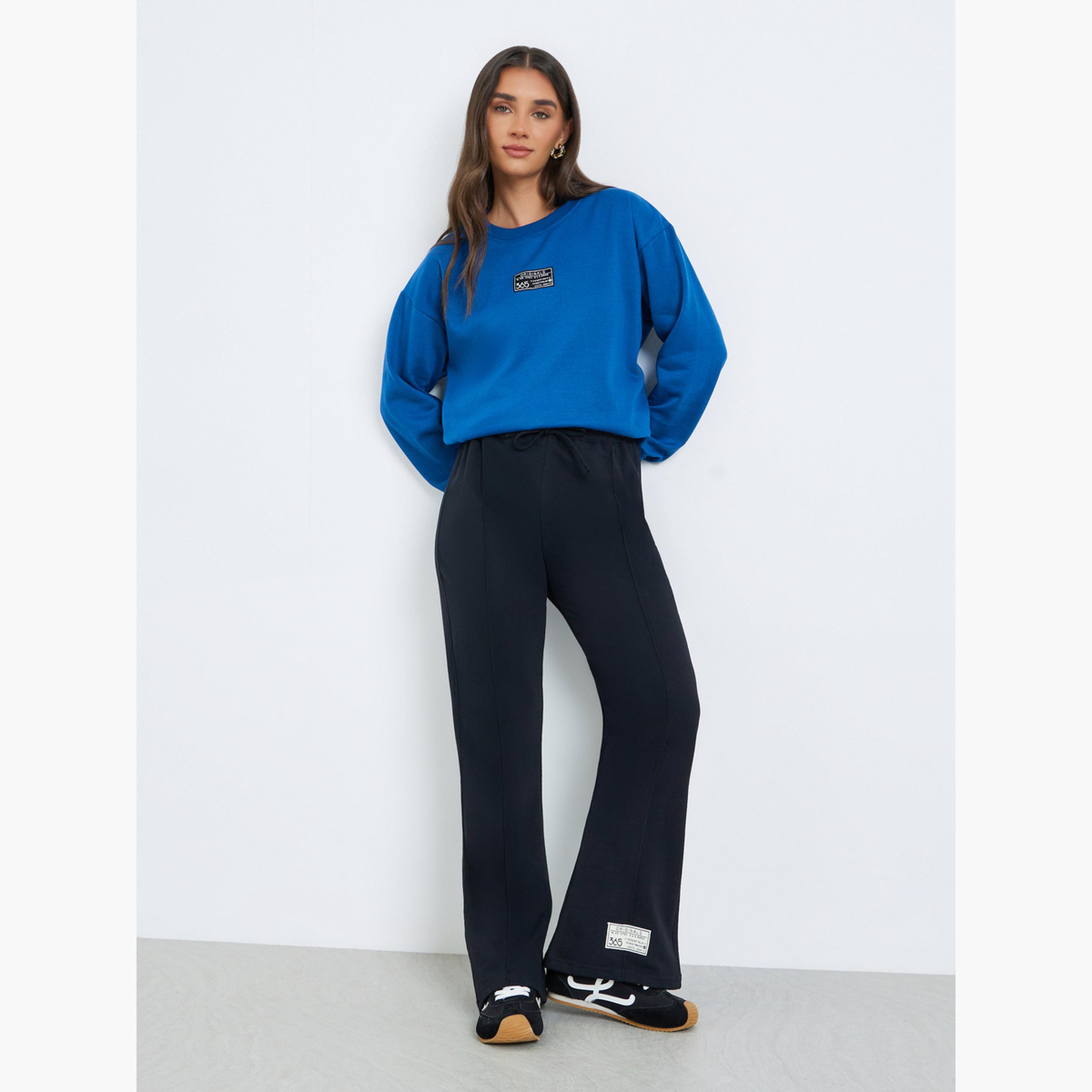 جوغر بأرجل واسعة وتفاصيل شارة-women-clothing-bottoms-joggers-image-2