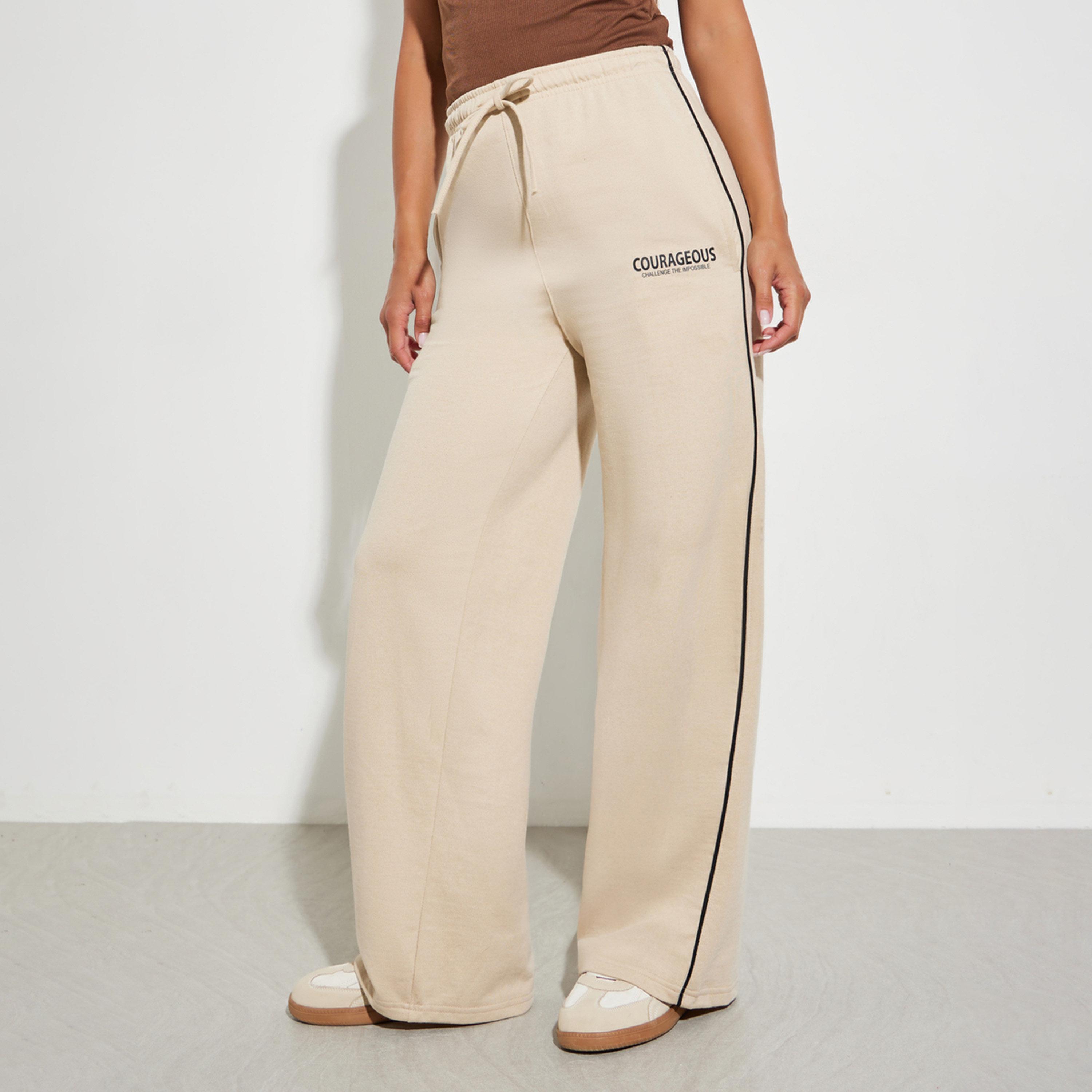 جوغر بأرجل واسعة وتفاصيل خطوط بيج-women-clothing-bottoms-joggers-image-1