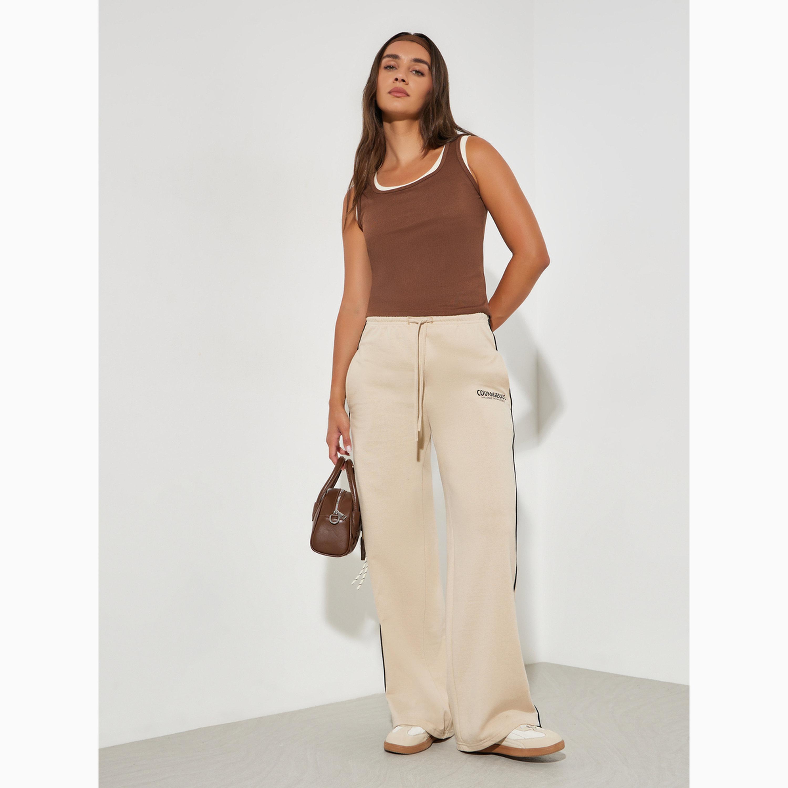 جوغر بأرجل واسعة وتفاصيل خطوط بيج-women-clothing-bottoms-joggers-image-2