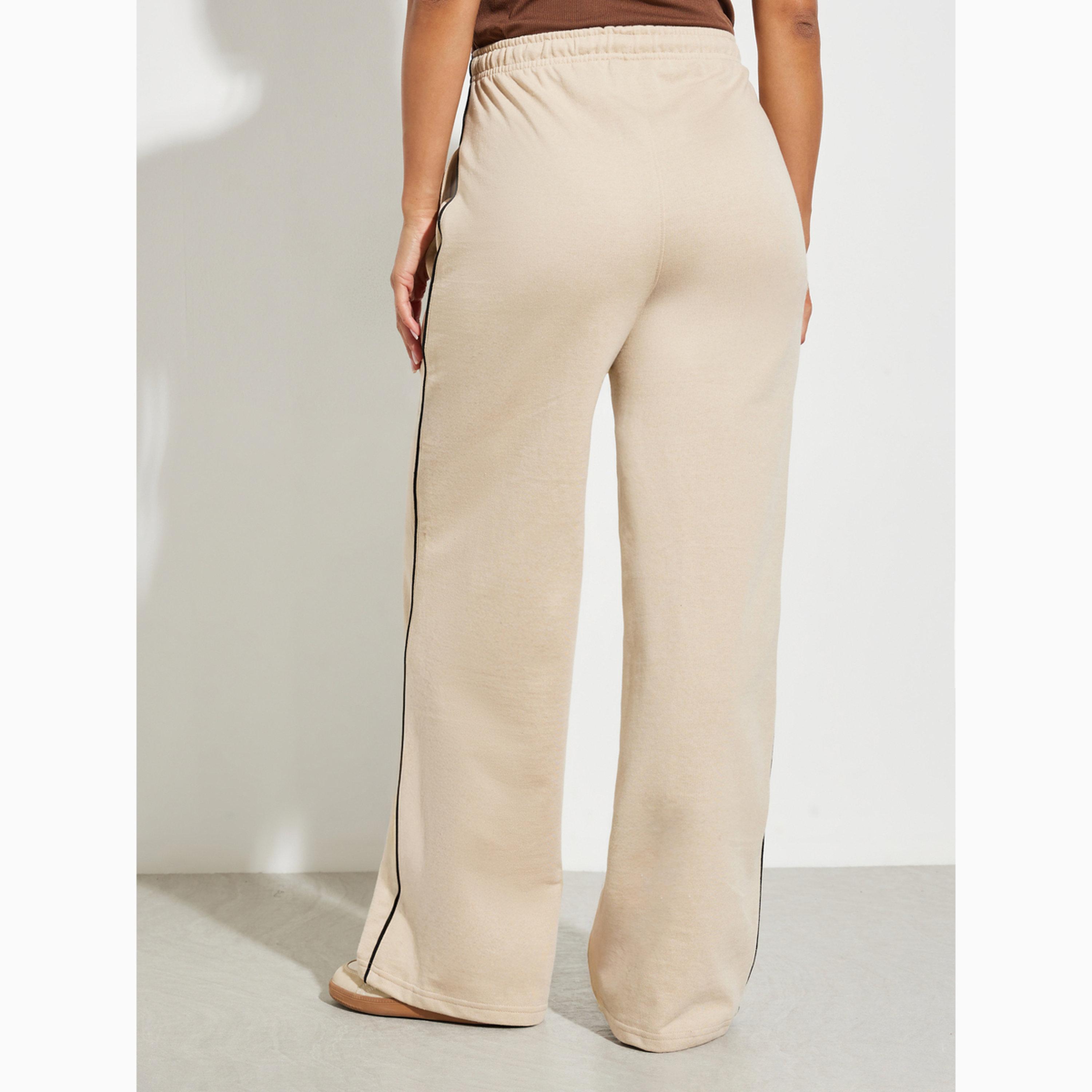 جوغر بأرجل واسعة وتفاصيل خطوط بيج-women-clothing-bottoms-joggers-image-4