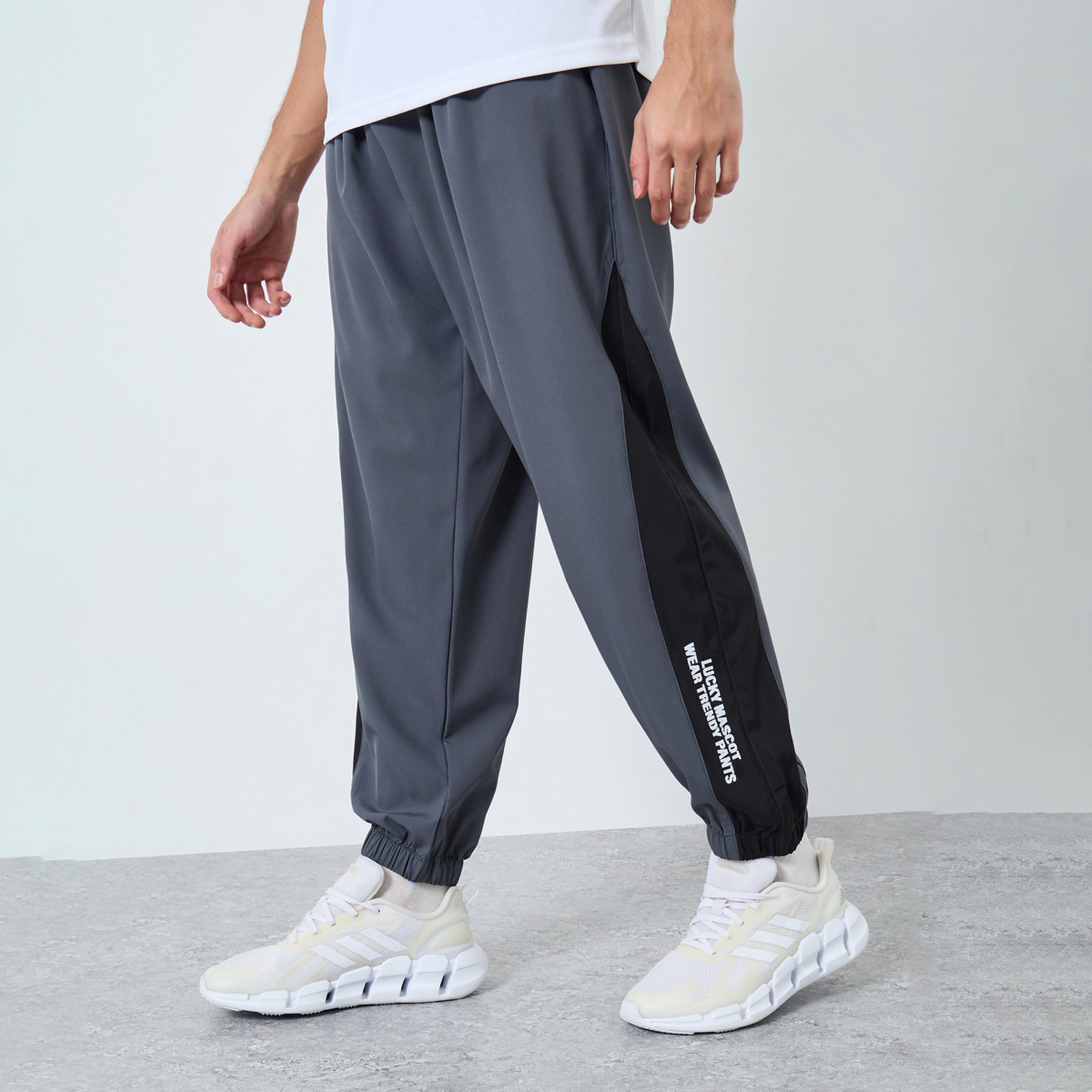 Styli Men Grey Placement Print Regular Fit Track Pants with Side Panel-men-clothing-sportswearandactivewear-bottoms-joggers-image-1
