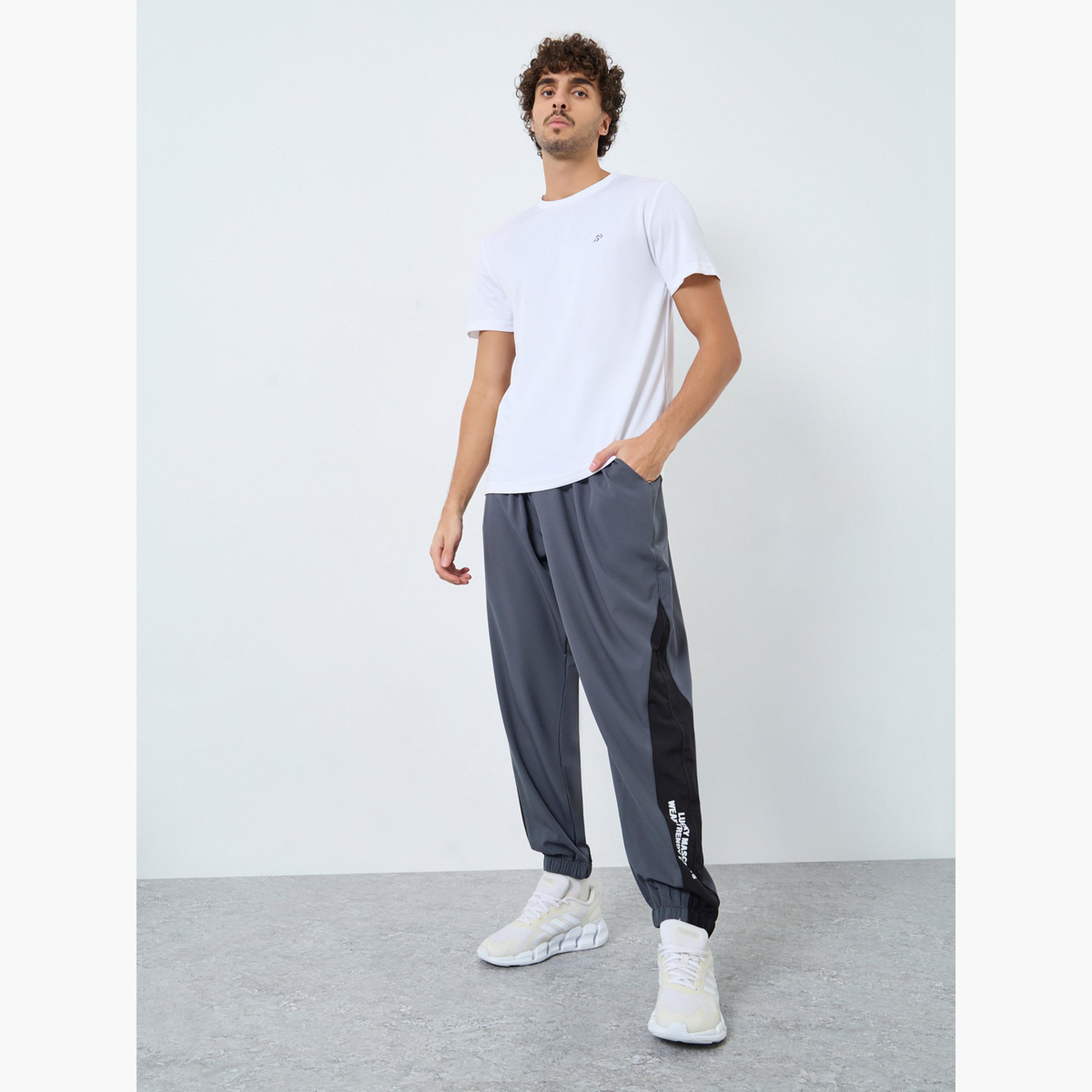 Styli Men Grey Placement Print Regular Fit Track Pants with Side Panel-men-clothing-sportswearandactivewear-bottoms-joggers-image-2