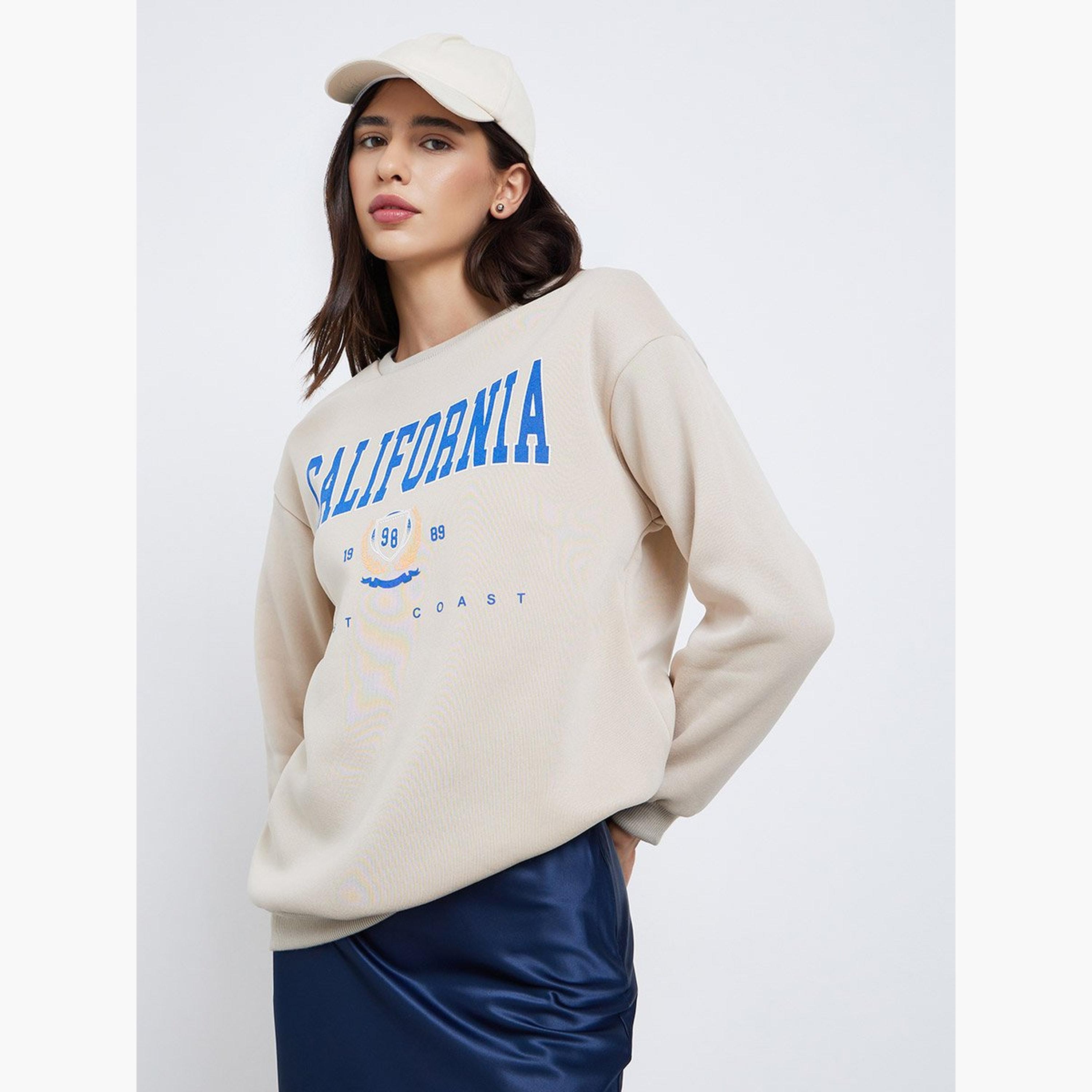 تيك تو - سويت شيرت قصّة مريحة بطبعة كاليفورنيا باللون البيج-women-clothing-hoodiesandsweatshirts-sweatshirts-image-1