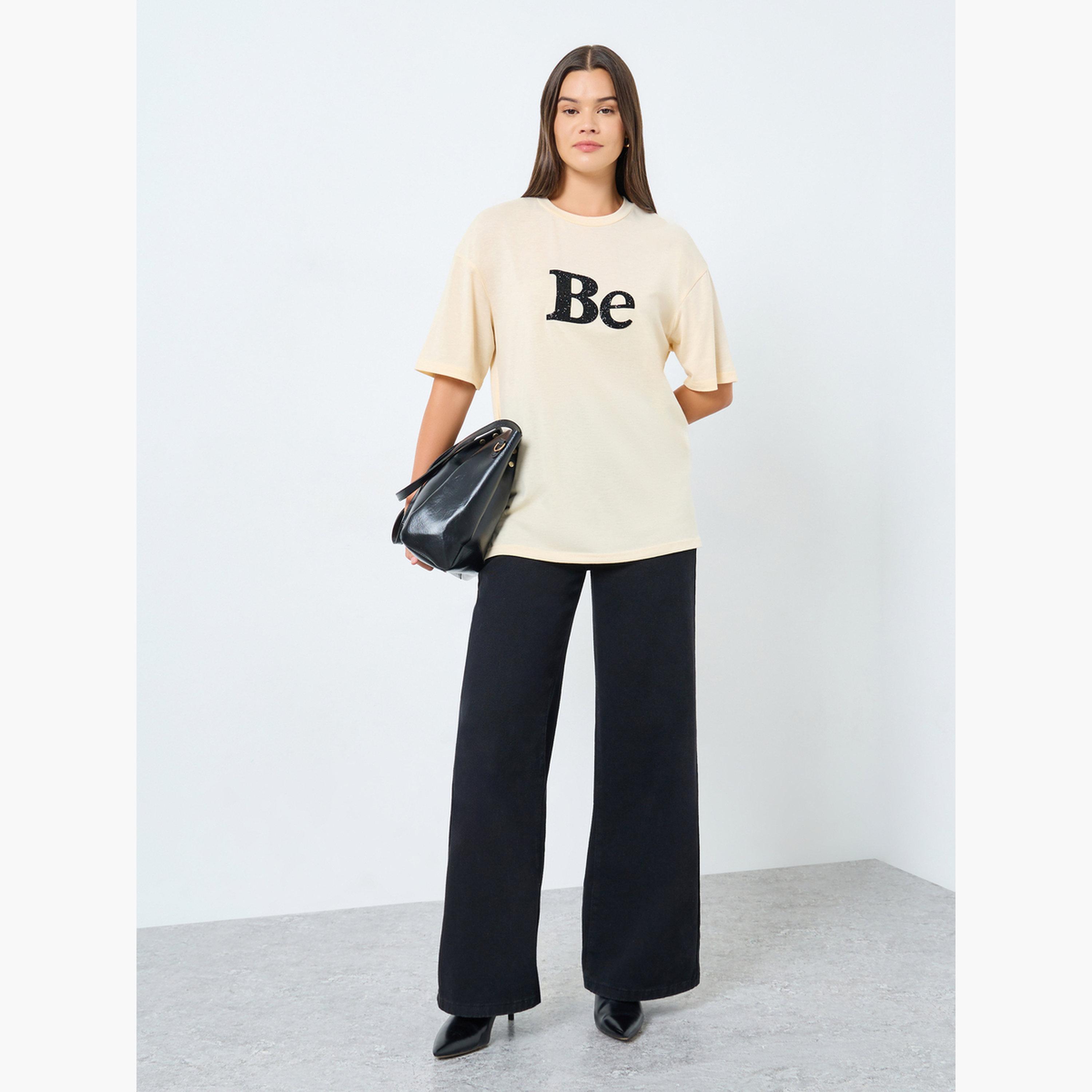 Styli Beige Oversized Embellished Slogan T-Shirt-women-clothing-tshirts-image-2