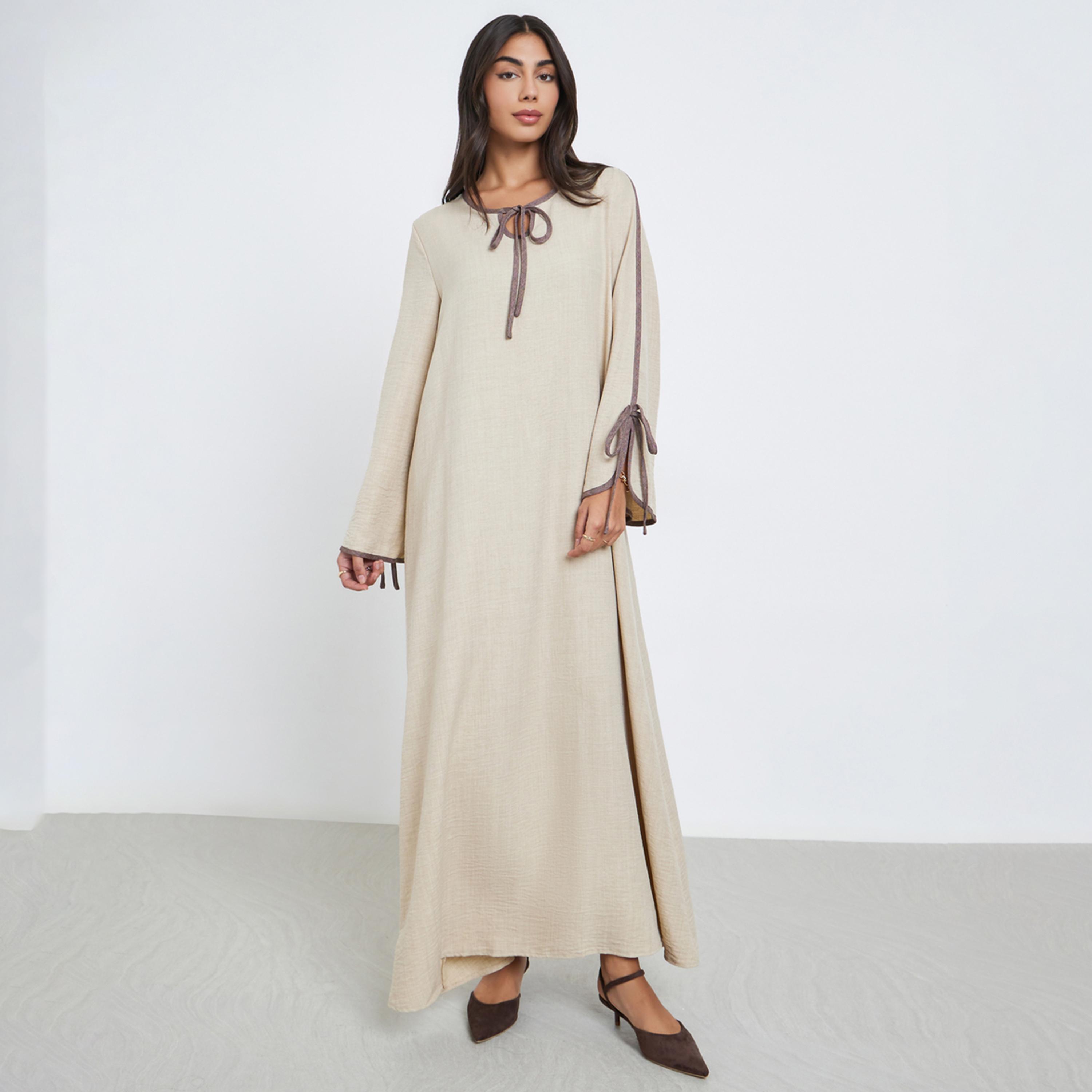 Amirah X Styli Beige Tie-Up Detail Jalabiya with Contrast Piping-women-arabicclothing-jalabiyas-image-1