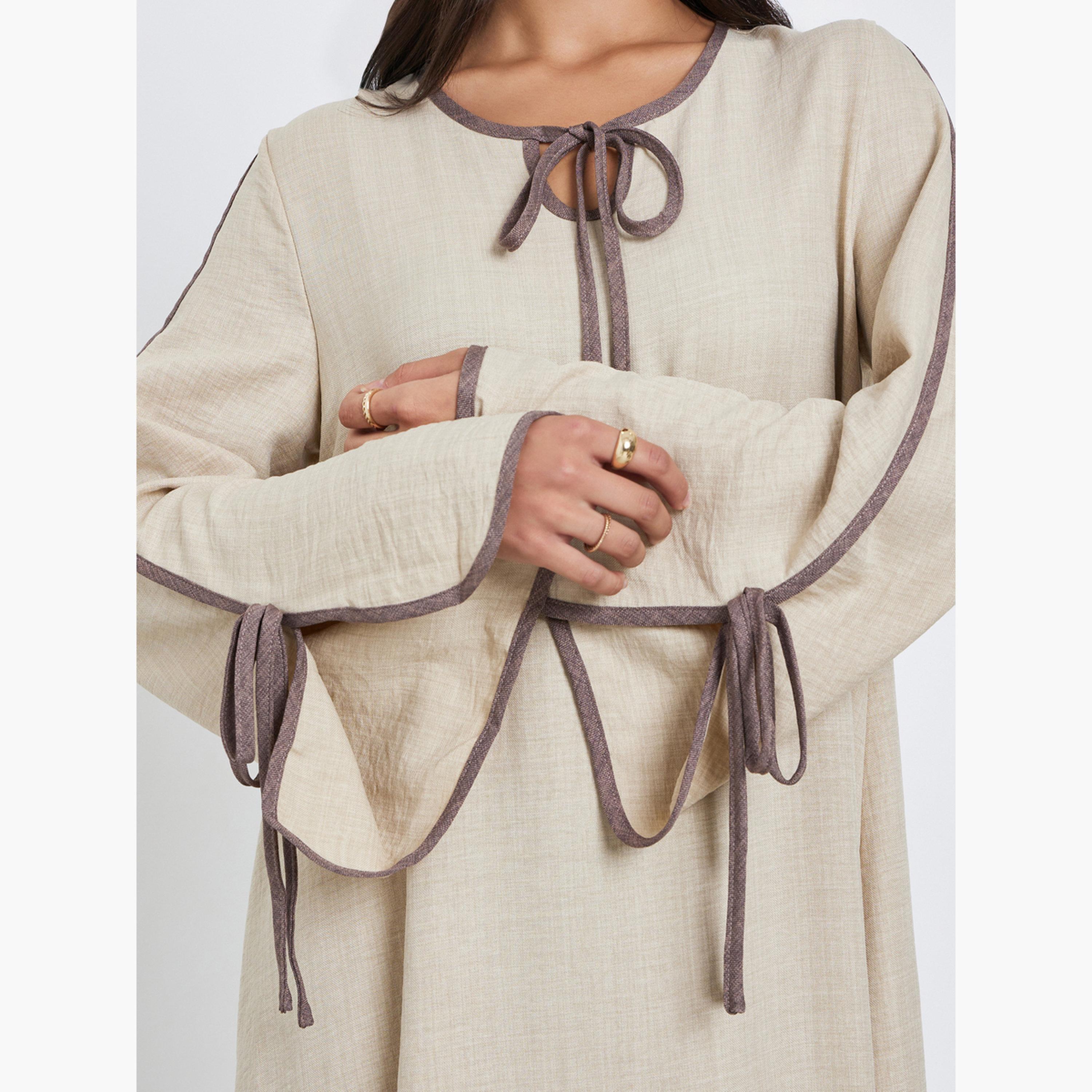 Amirah X Styli Beige Tie-Up Detail Jalabiya with Contrast Piping-women-arabicclothing-jalabiyas-image-4