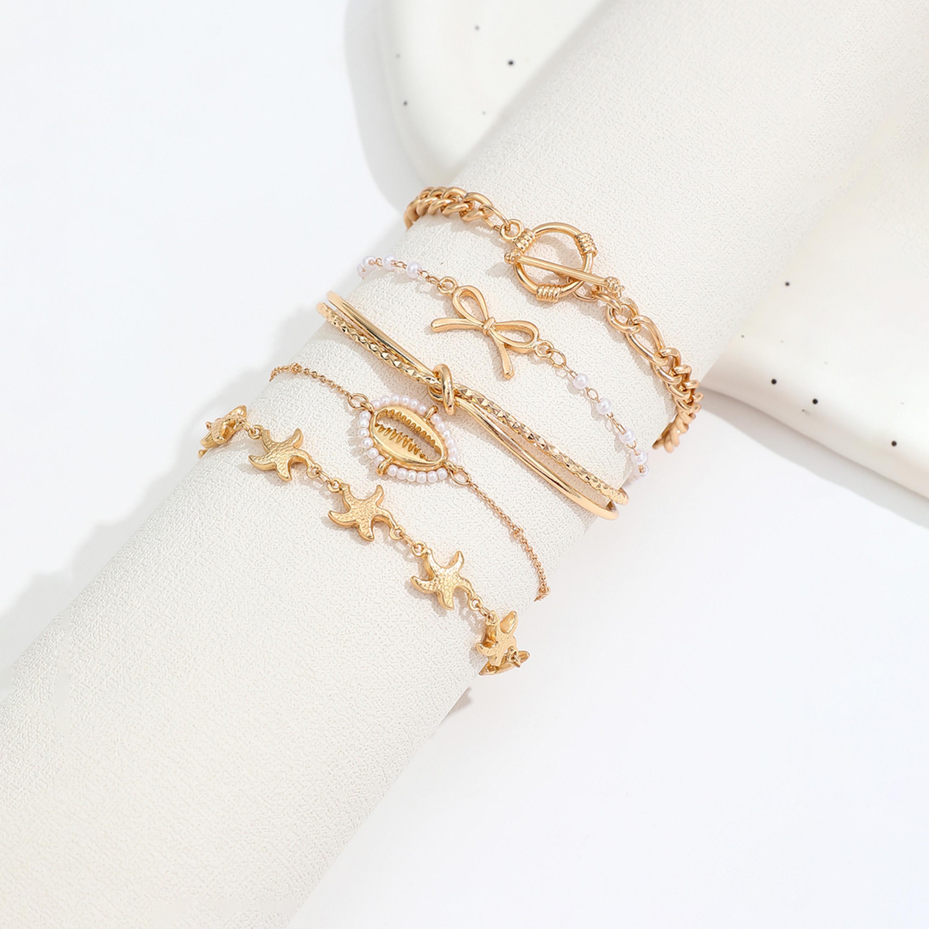 تيك تو - مجموعة من 5 أساور متنوعة مزينة بفيونكة-women-watchesandjewellery-jewellery-banglesandbracelets-image-1