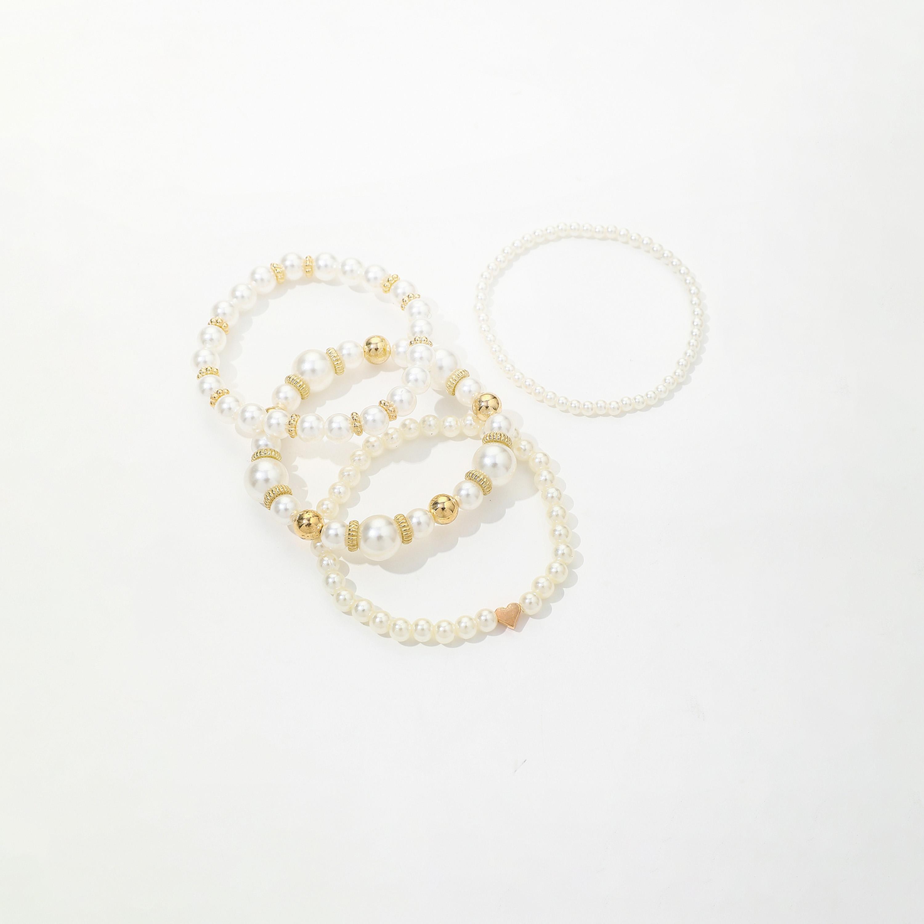 تيك تو - مجموعة من 5 أساور من اللؤلؤ الصناعي-women-watchesandjewellery-jewellery-banglesandbracelets-image-1