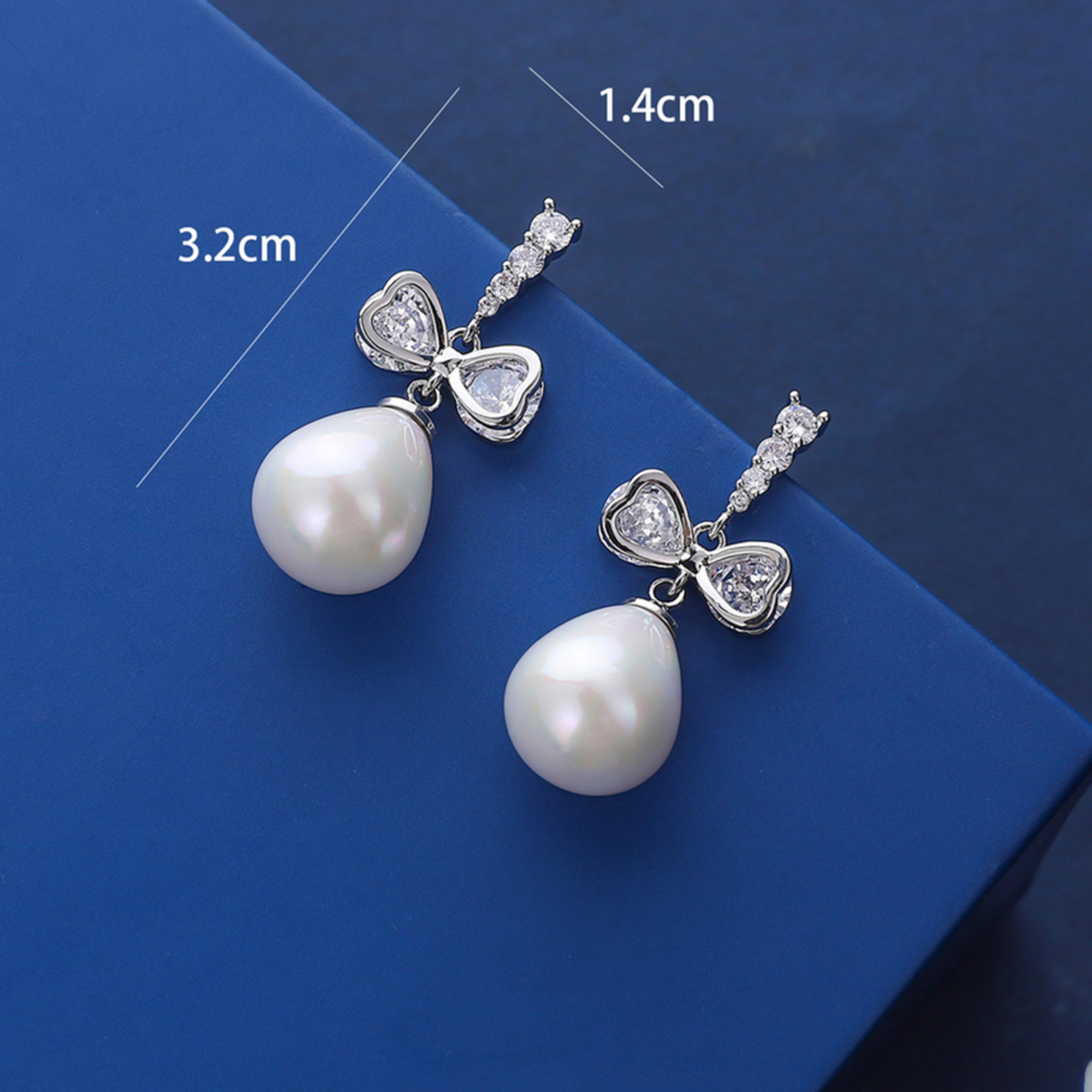 تيك تو - أقراط متدلية من الفضة على شكل فيونكة من اللؤلؤ الصناعي-women-watchesandjewellery-jewellery-earrings-image-2