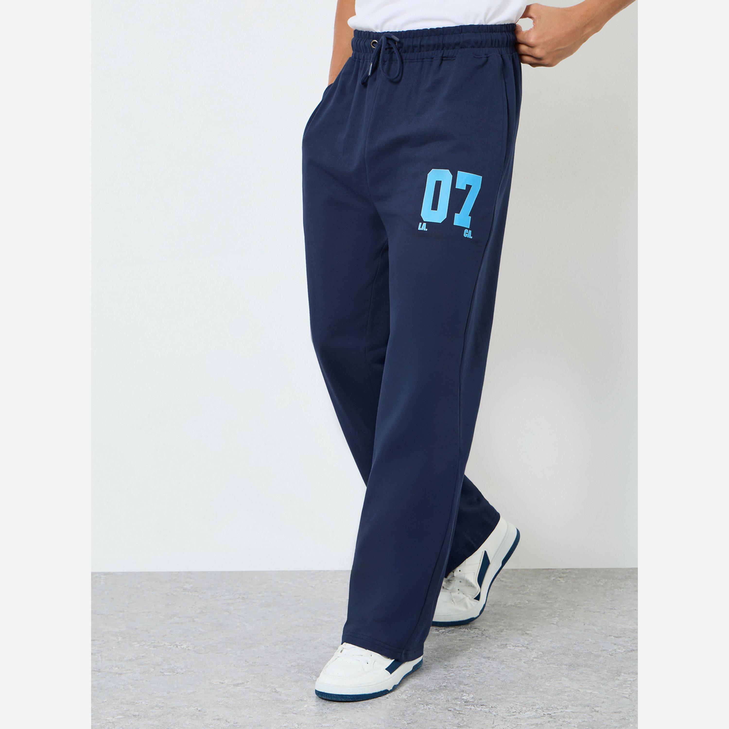 ستايلي - بنطال رياضي رجالي مقاس واسع قماش تيري لون أزرق داكن-men-clothing-bottoms-joggers-image-1