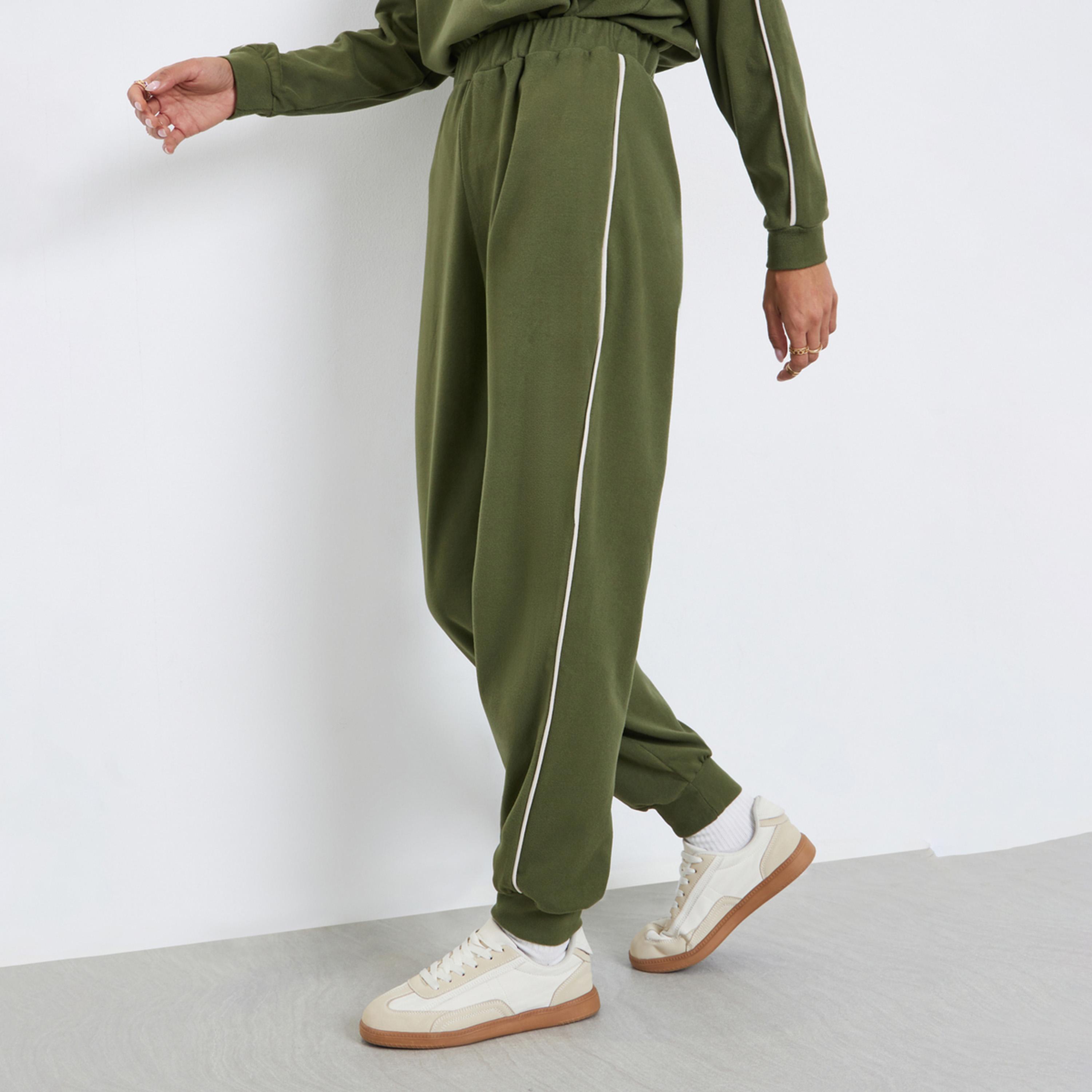 Styli Women Green Plain Relaxed Fit Joggers with Piping Detail-women-clothing-bottoms-joggers-image-1