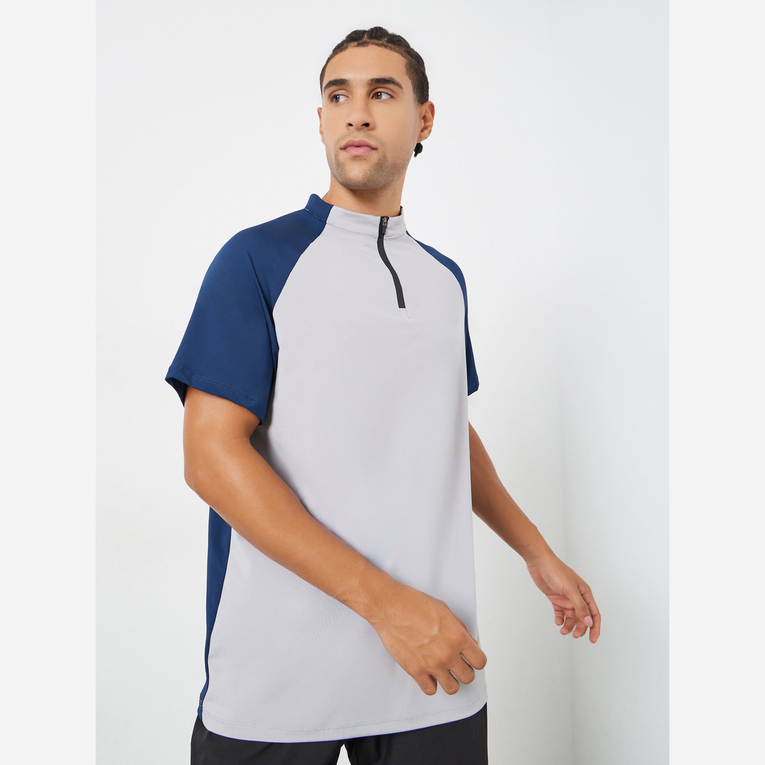 ستايلي - تيشيرت رياضي رجالي لون أزرق داكن أكمام راغلان-men-clothing-sportswearandactivewear-tshirtsandpolos-image-1
