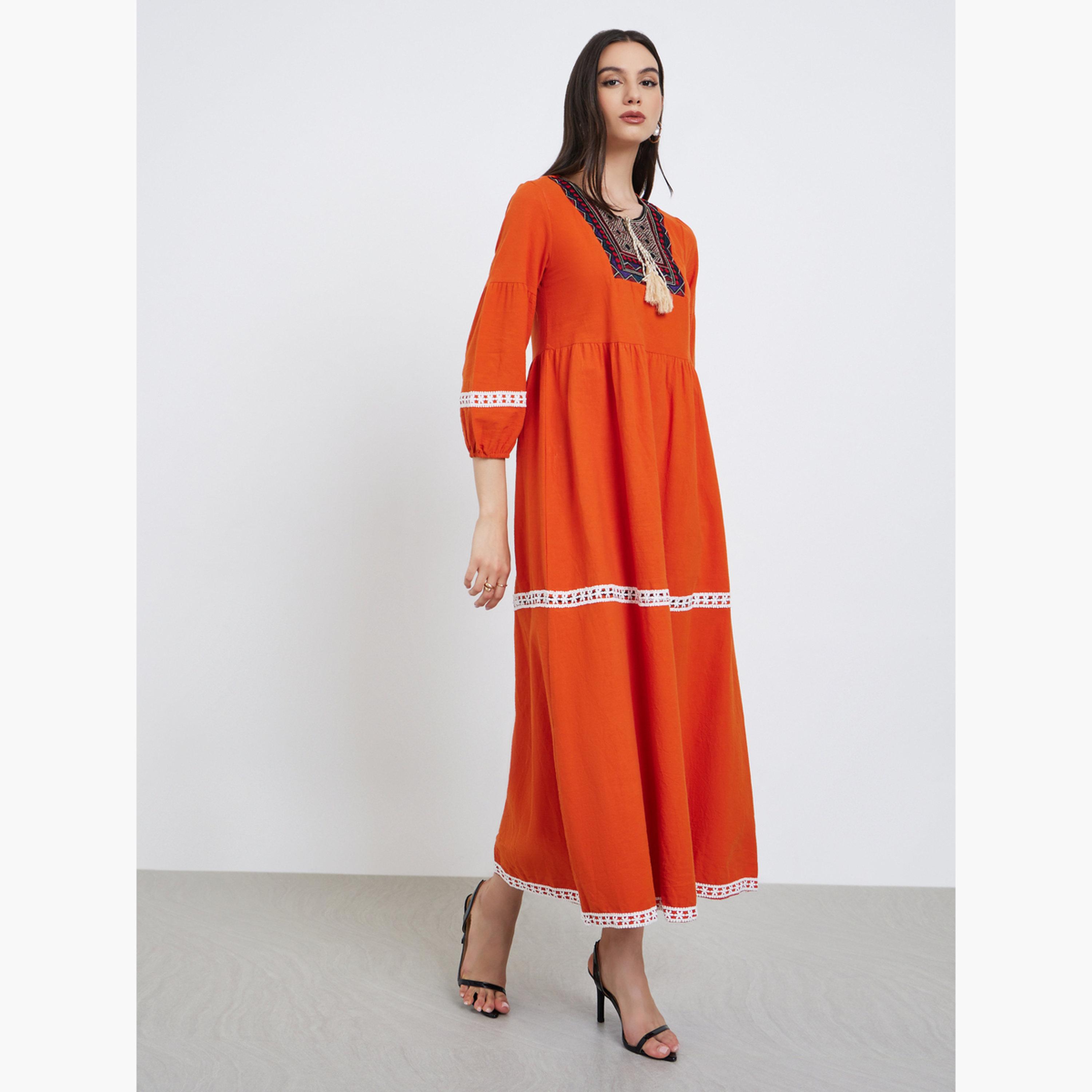 تيك تو - جلابية برتقالية بأكمام مرنة مزينة بشراشيب ورسومات جرافيكية-women-arabicclothing-jalabiyas-image-2