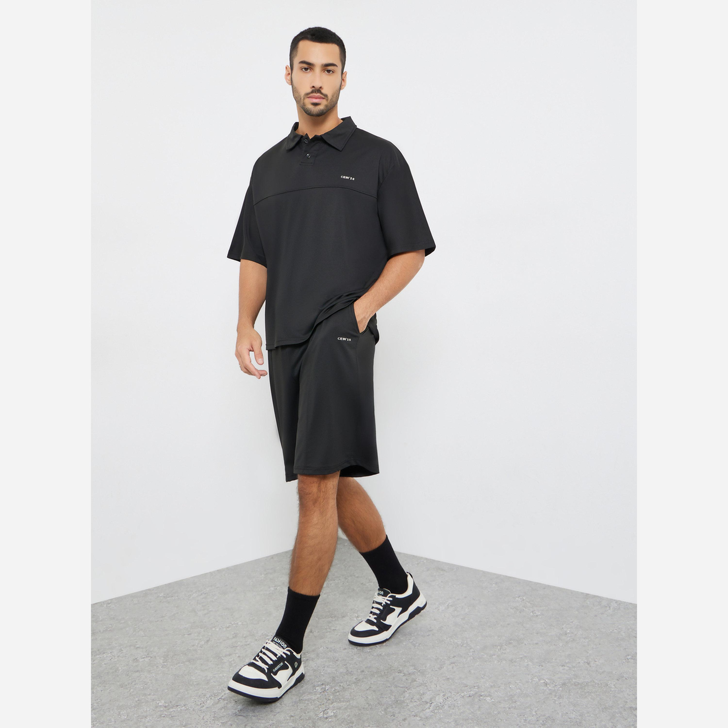 ستايلي - طقم رجالي لون أسود قميص بولو وشورت مقاس واسع بتفاصيل خياطة مميزة-men-clothing-coordsets-image-1