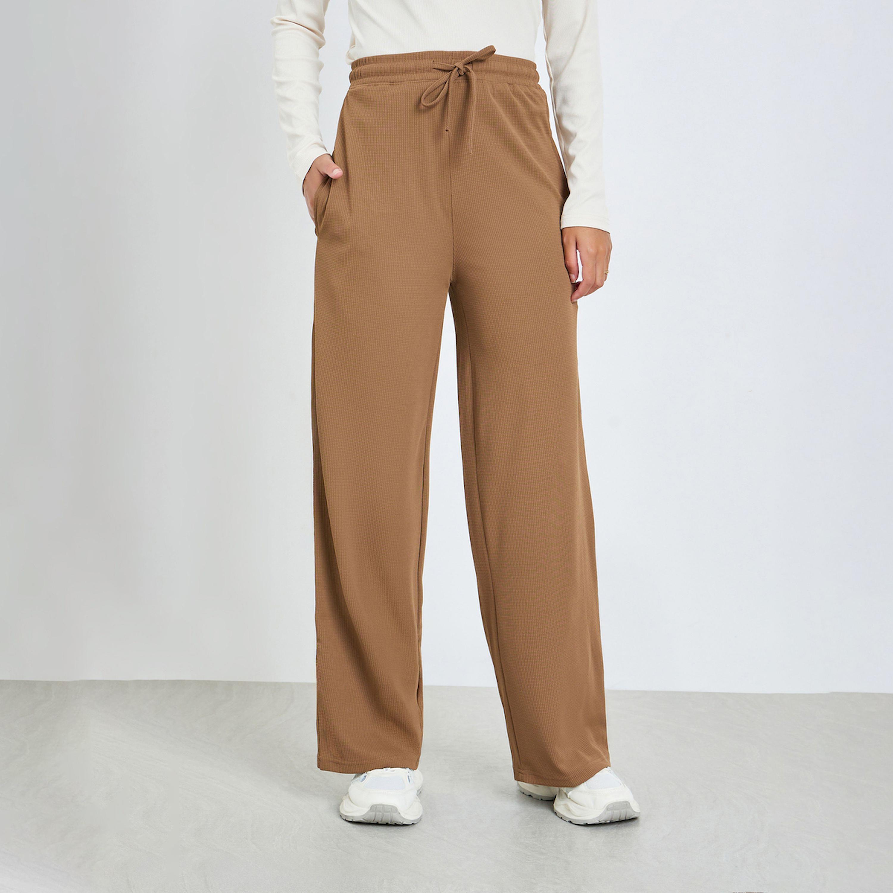 Styli Beige Solid Wide Leg Joggers-women-clothing-bottoms-joggers-image-1