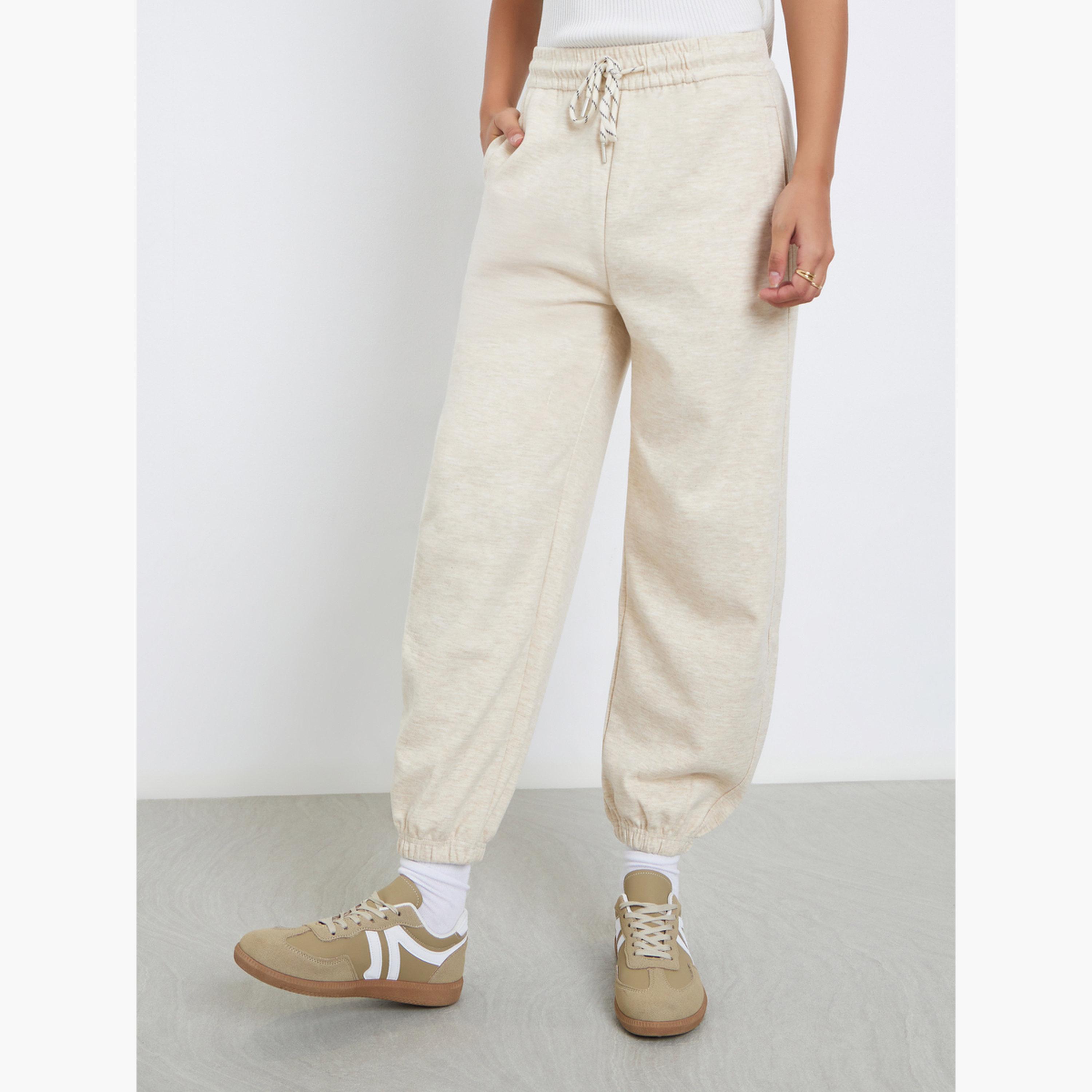 Styli Women Cream Solid Cuffed Joggers-women-clothing-bottoms-joggers-image-1