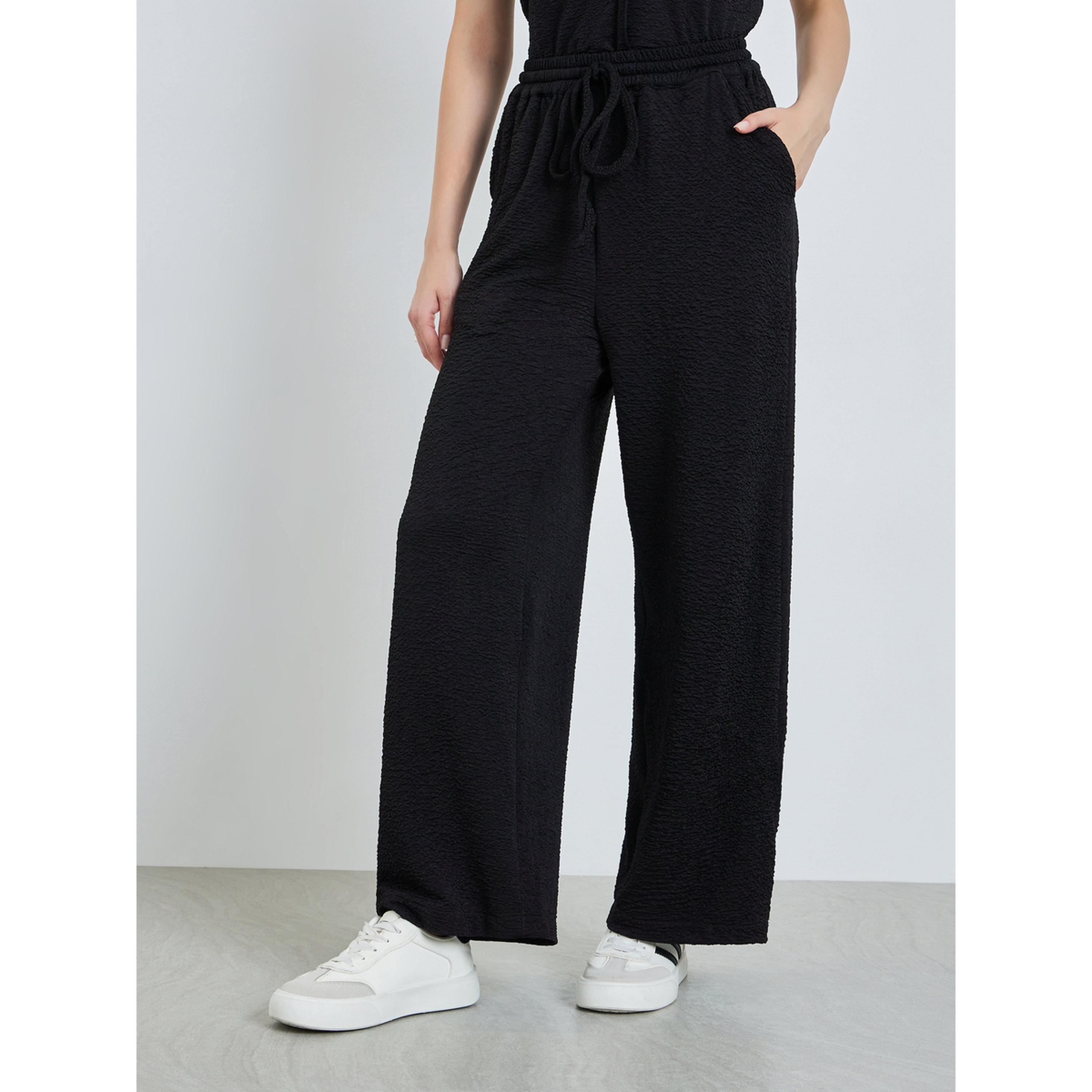 بنطال بأرجل واسعة ورباط لون أسود-women-clothing-bottoms-joggers-image-1
