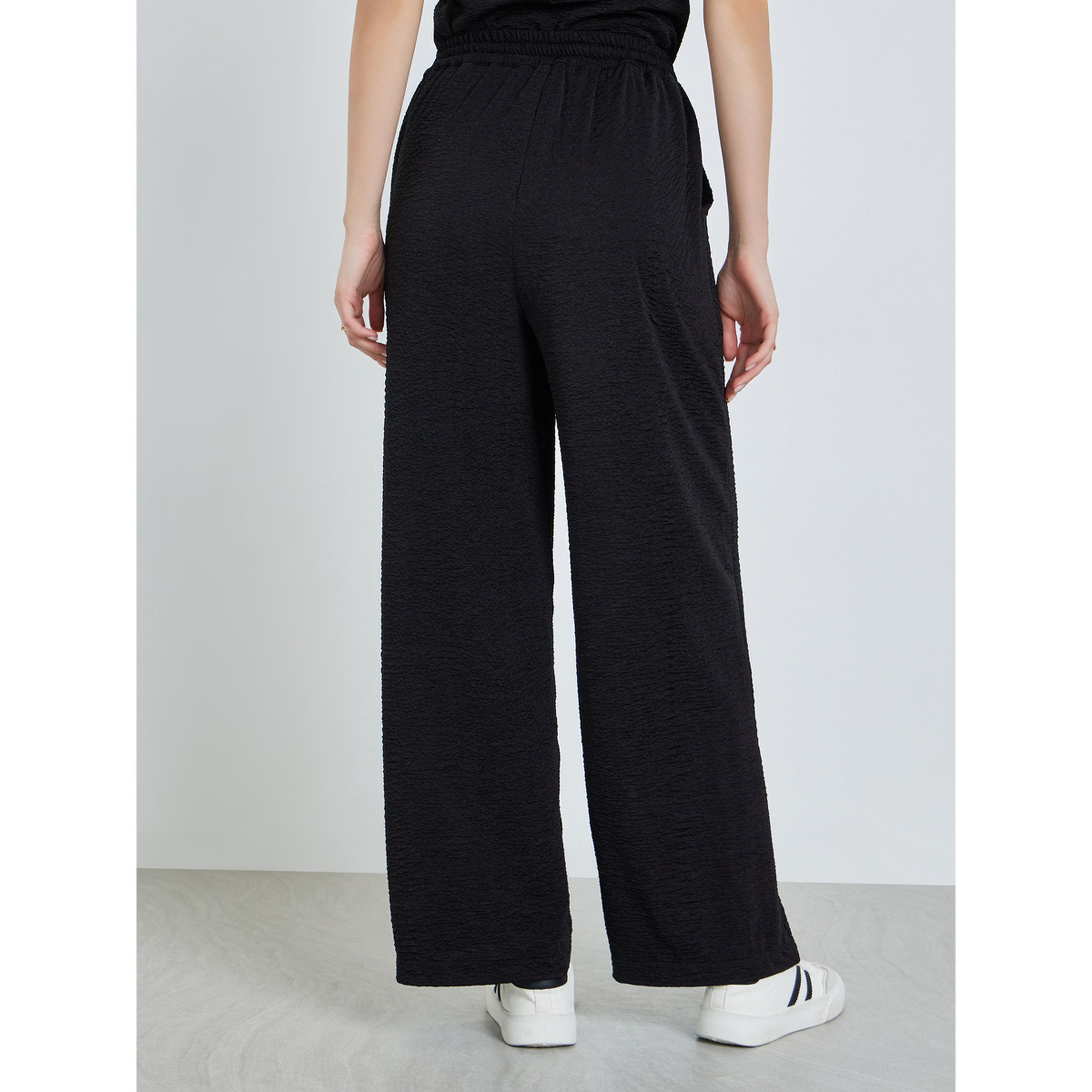 بنطال بأرجل واسعة ورباط لون أسود-women-clothing-bottoms-joggers-image-4