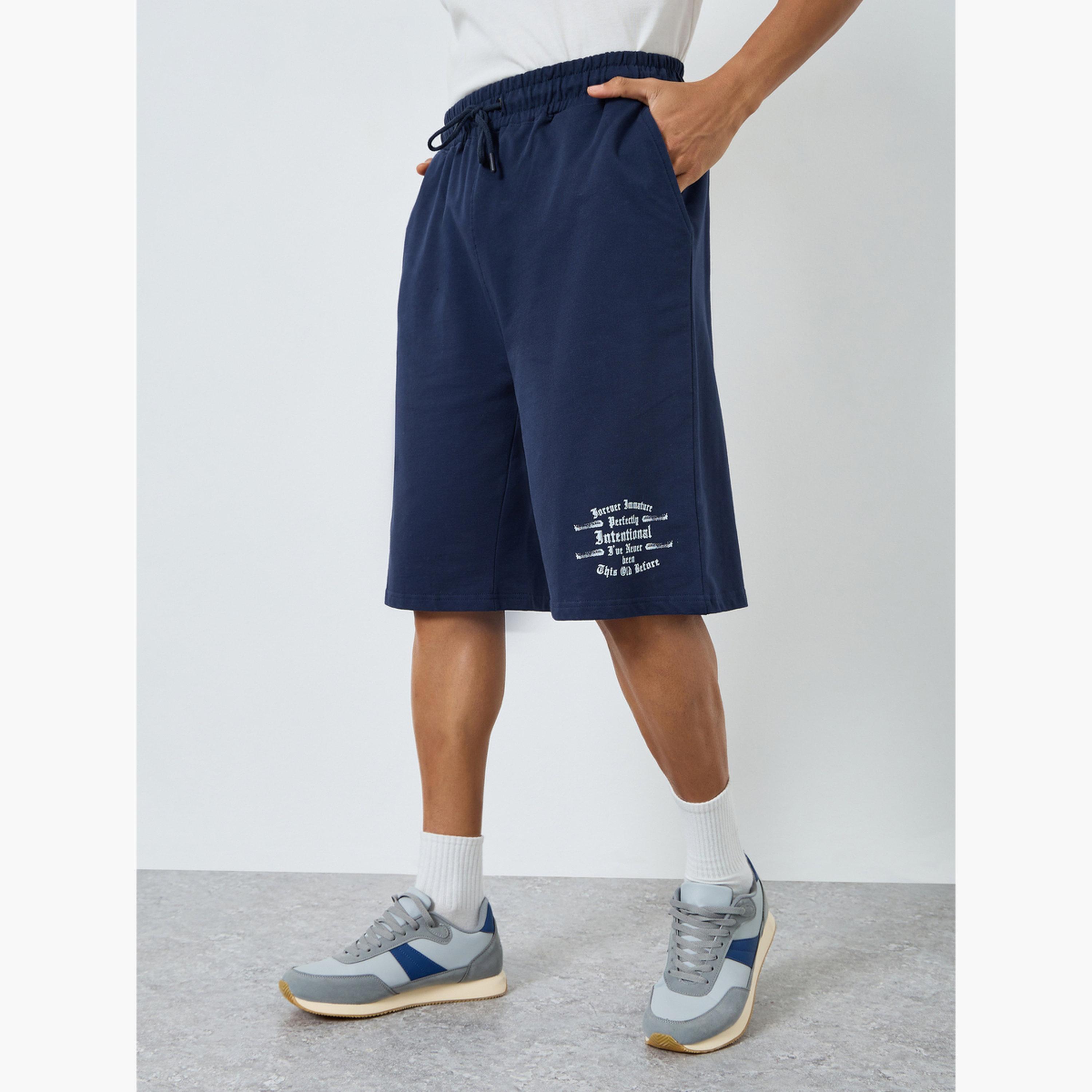 شورت بقصة واسعة مطبوع بمظهر باهت وممزق-men-clothing-bottoms-shorts-image-1