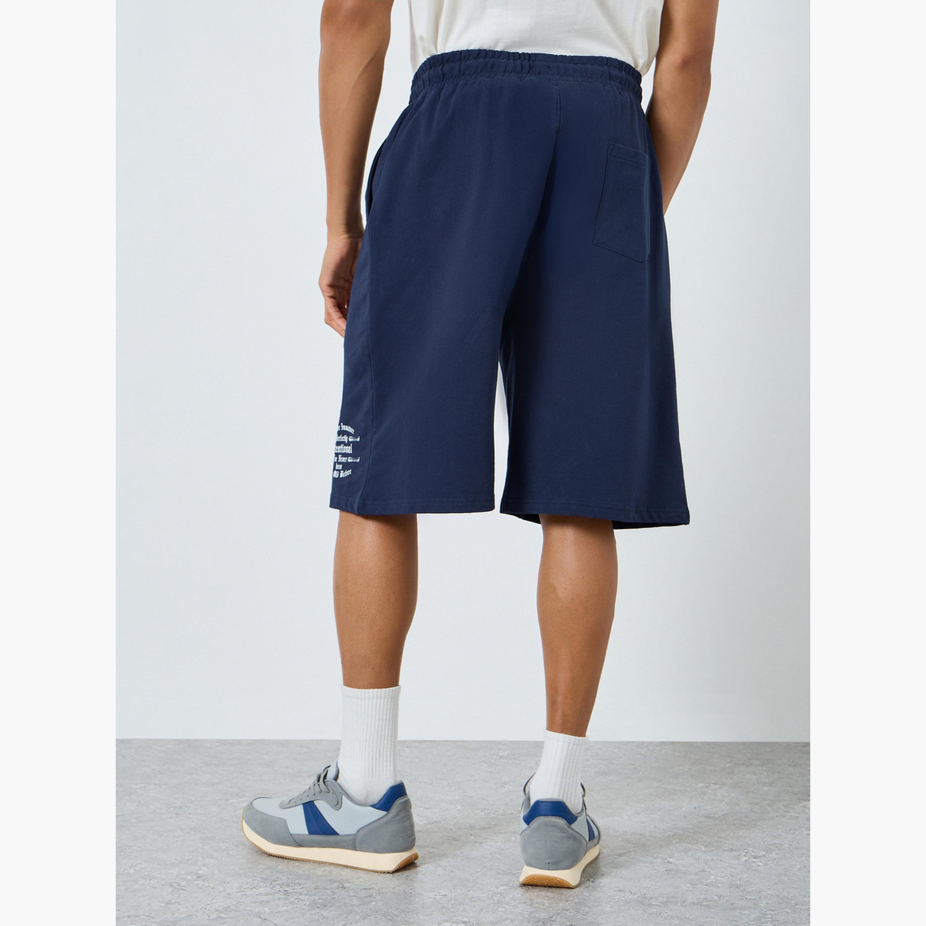 شورت بقصة واسعة مطبوع بمظهر باهت وممزق-men-clothing-bottoms-shorts-image-4