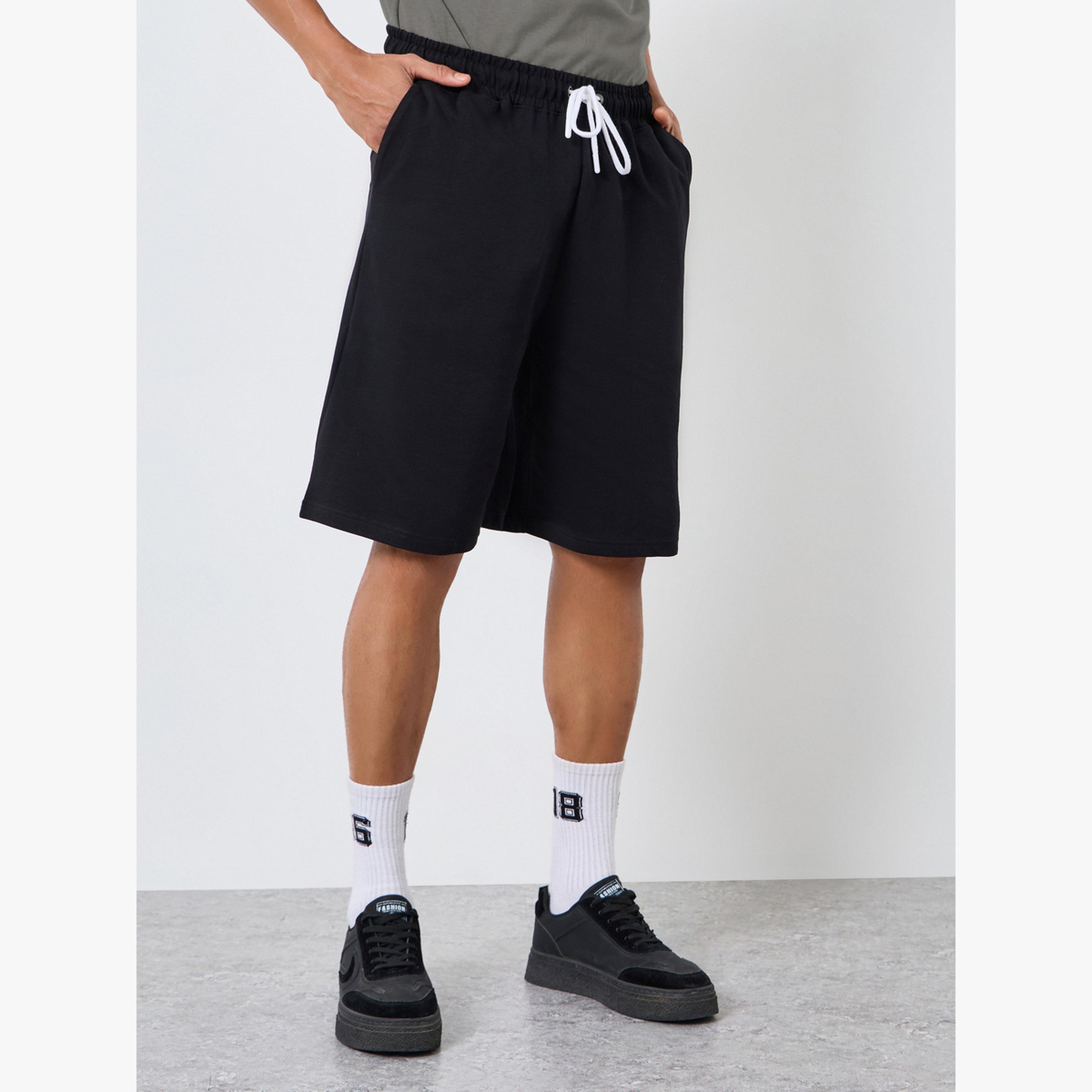 طقم منسق من شورت وتيشيرت قطن واسع-men-clothing-coordsets-image-4