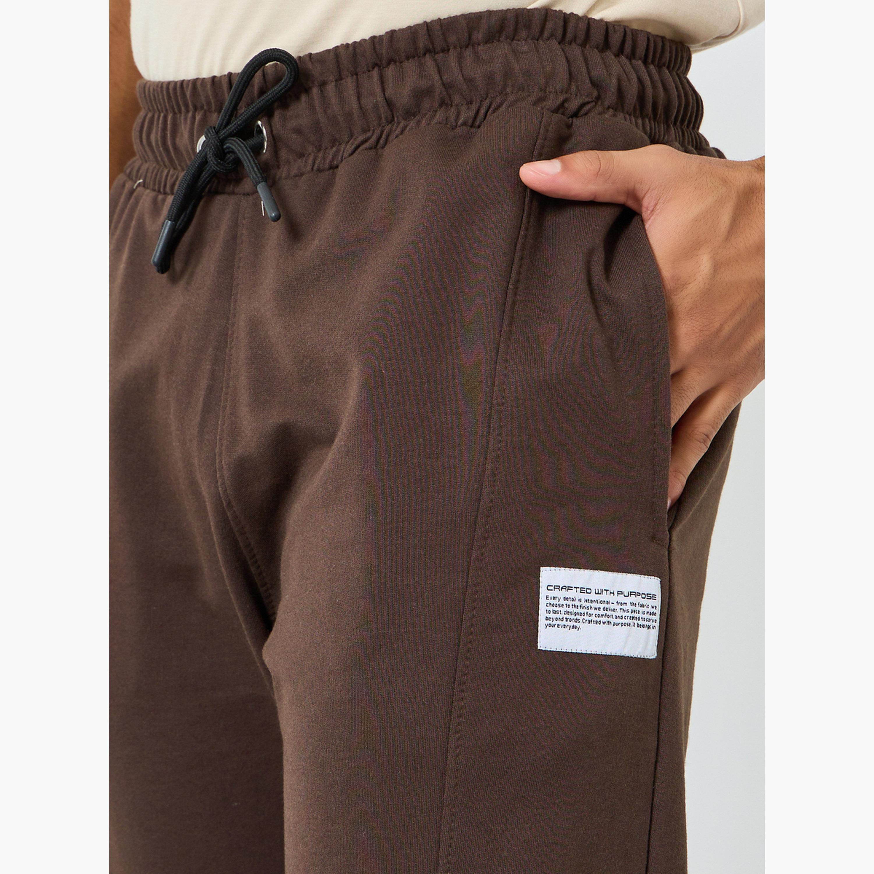 جوغر تيري قصة ضيقة بأجزاء متباينة وخصر مطاطي-men-clothing-bottoms-joggers-image-3